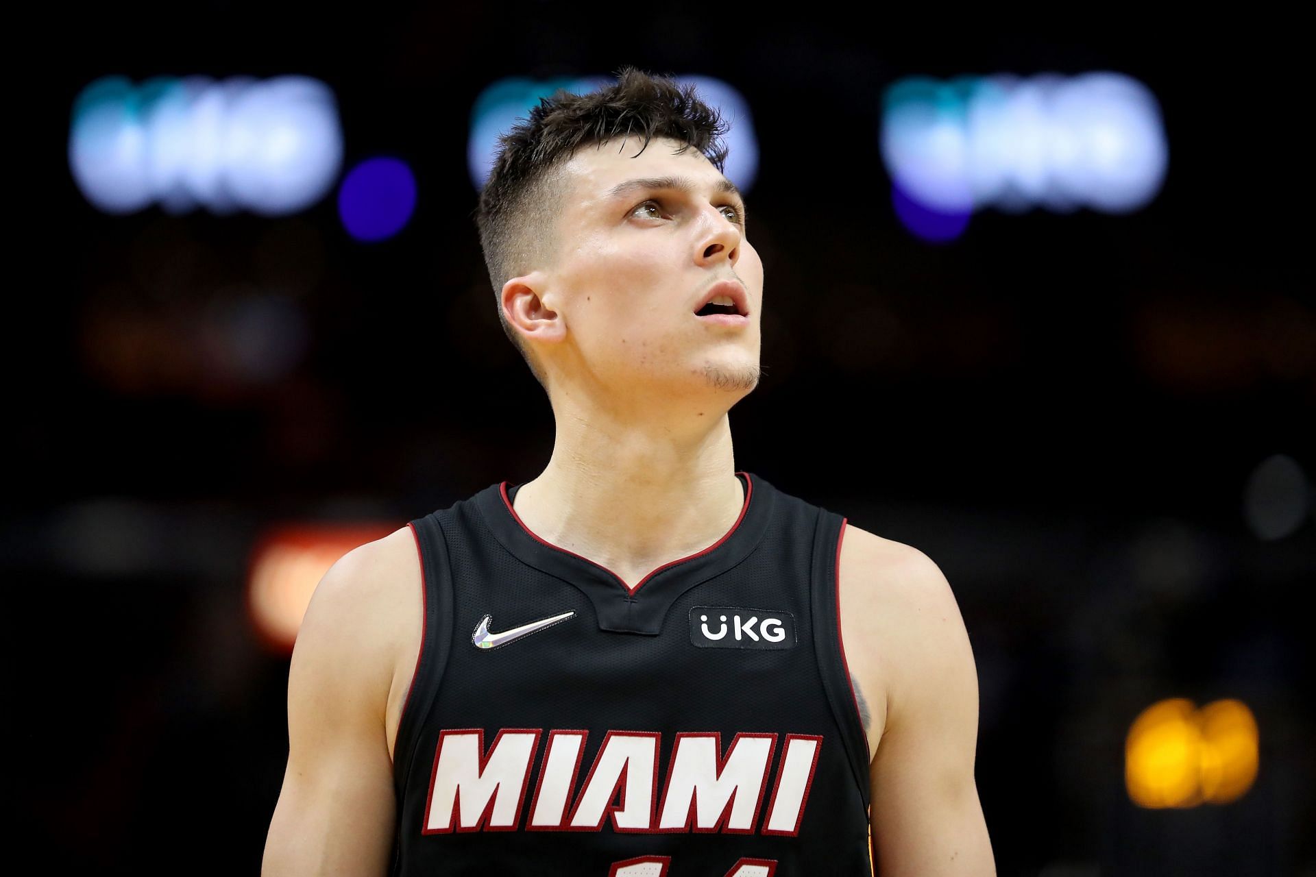 Tyler Herro looks on during the game