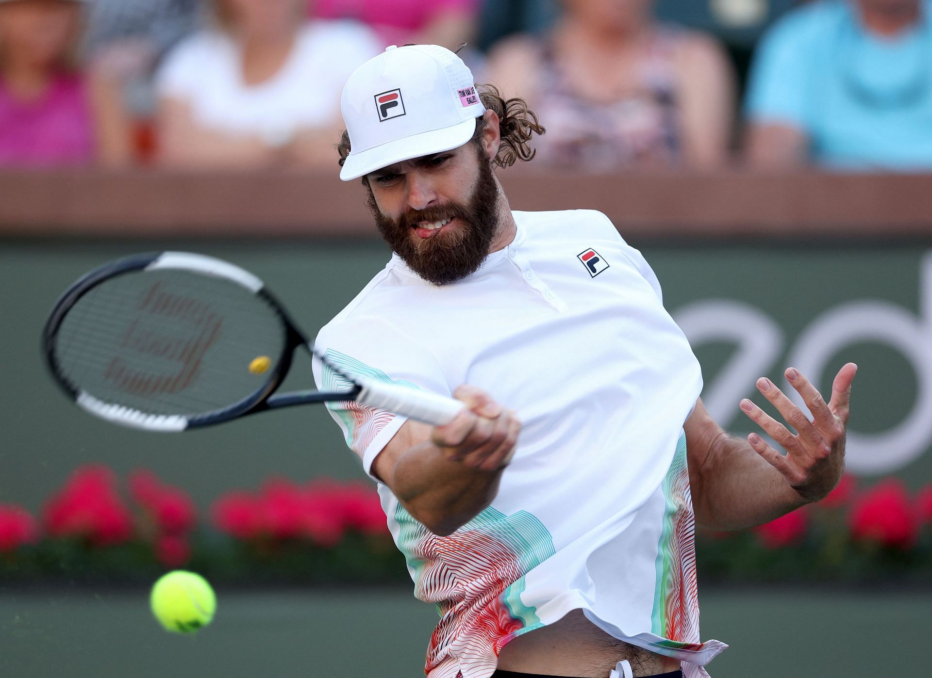 Reilly Opelka hits the ball against Denis Shapovalov