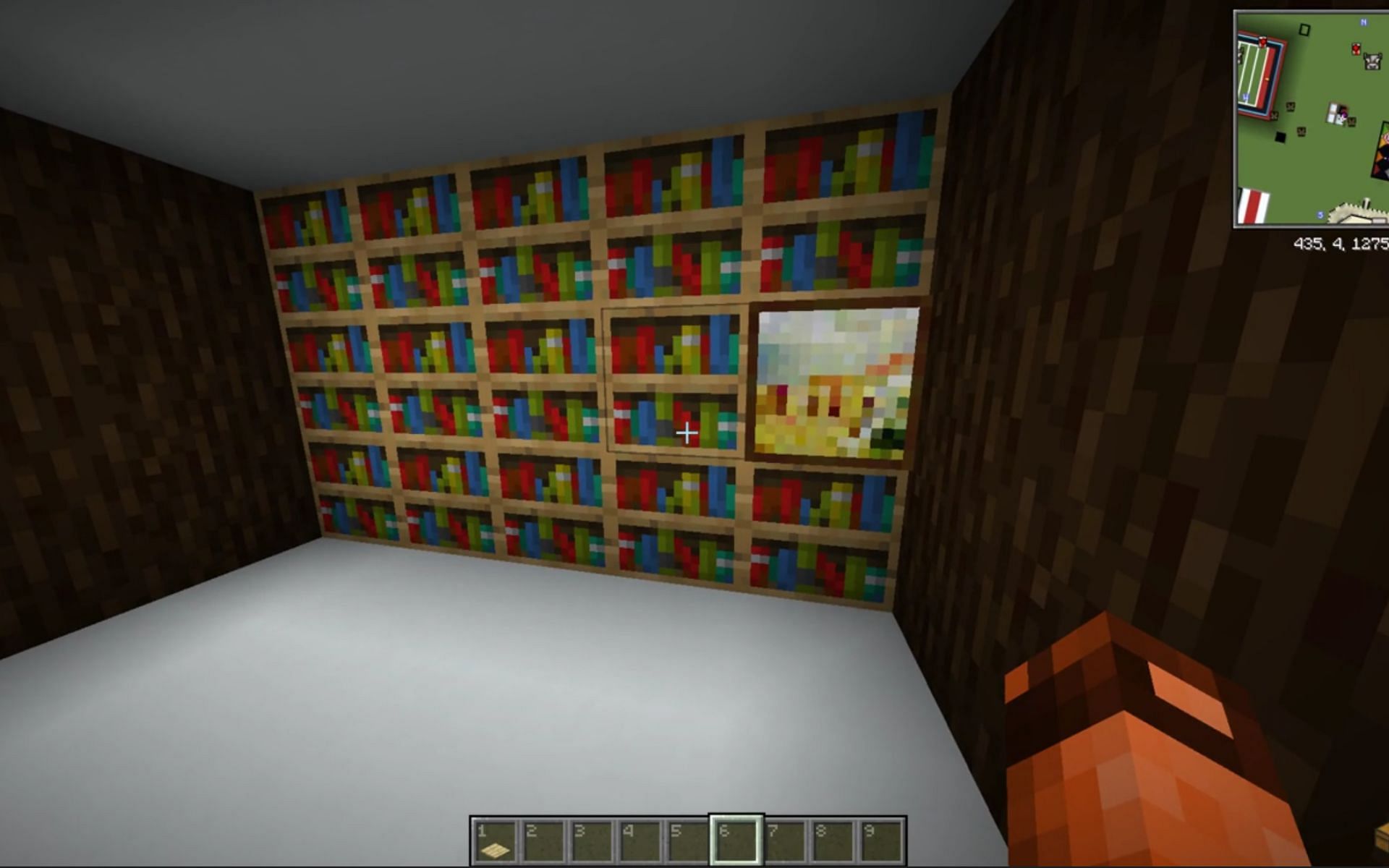 A chest hidden underneath the bookshelves (Image via u/manimanito100/Reddit)