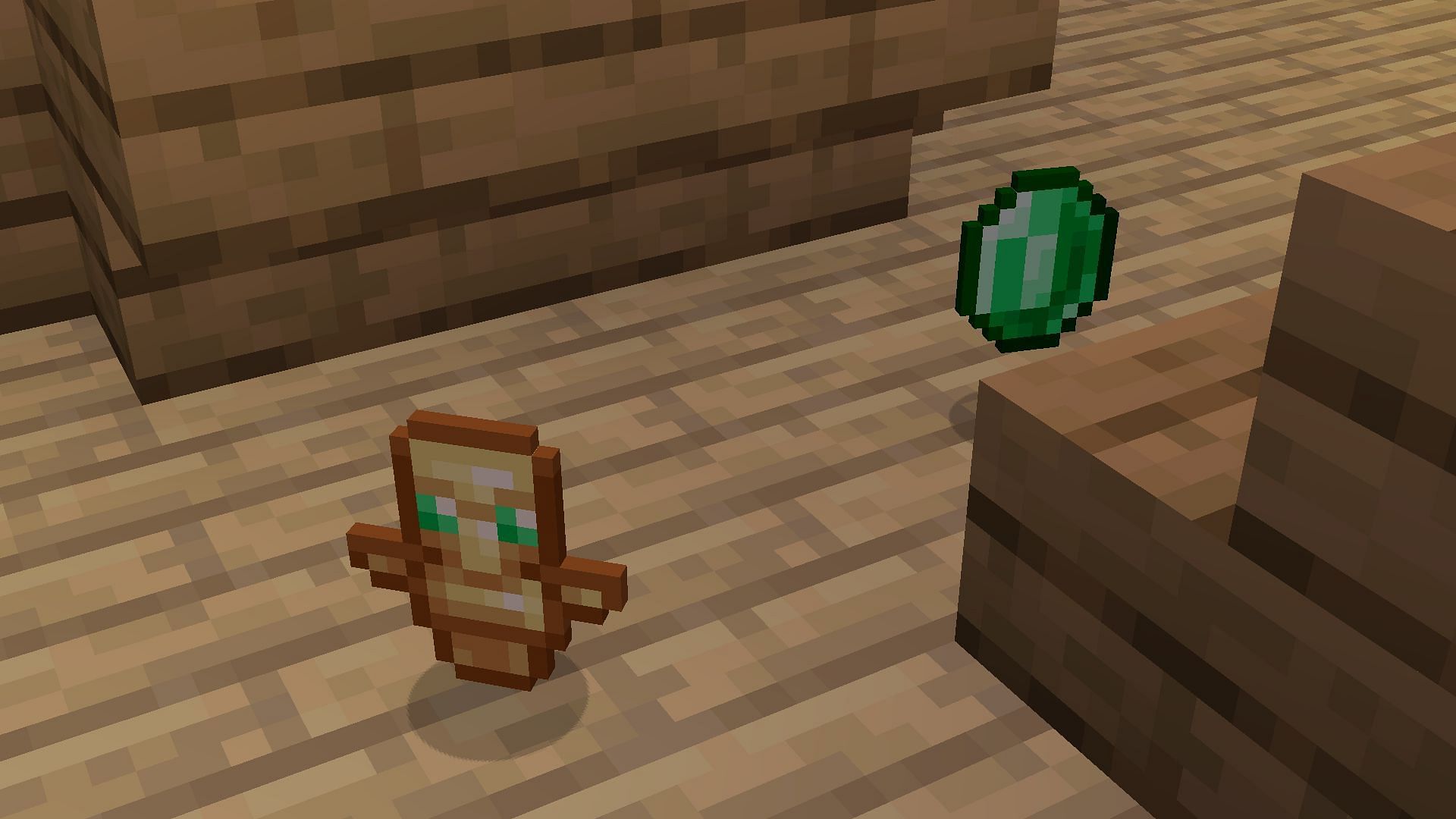 Dropped totem with some emeralds (Image via Mojang Studios)