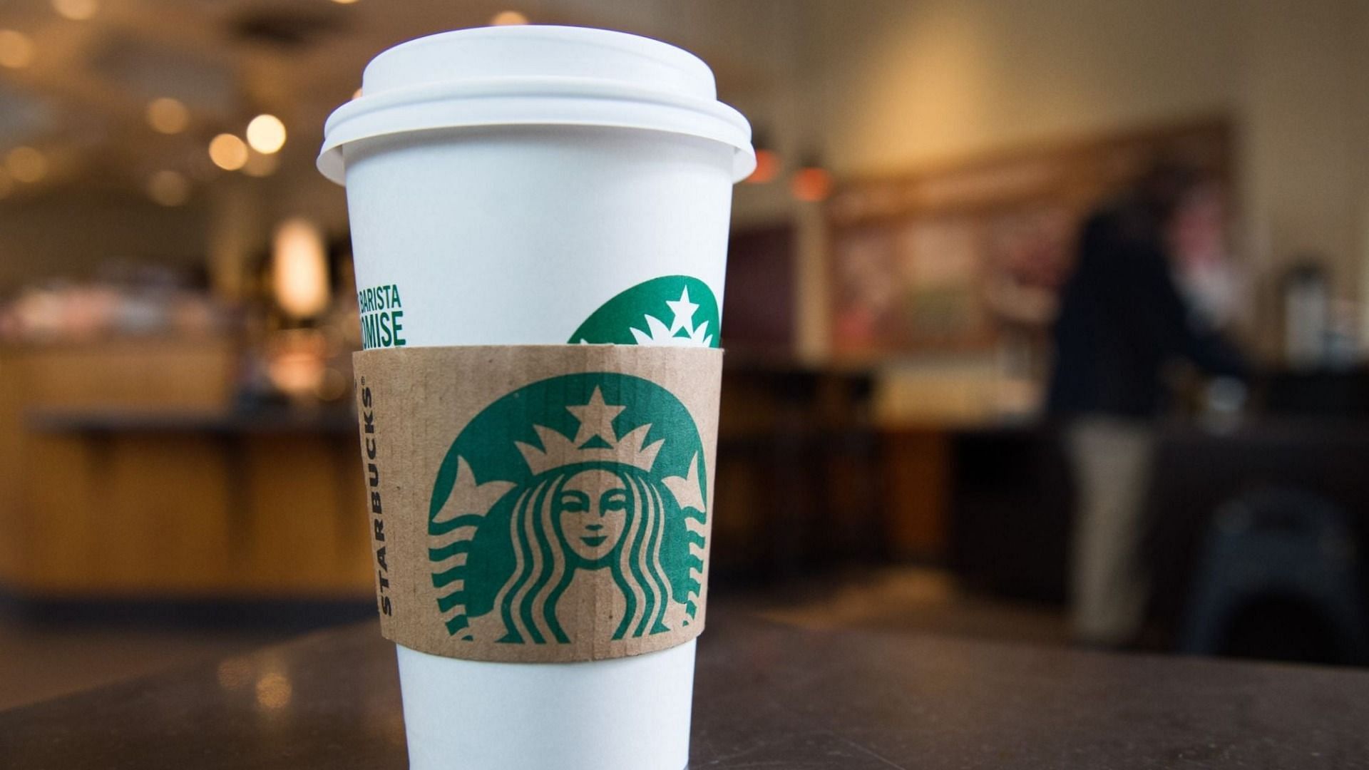 Starbucks might eliminate its disposable green-and-white cups to become a &quot;resource positive company&quot; (Image via Getty Images/ Saul Loeb)