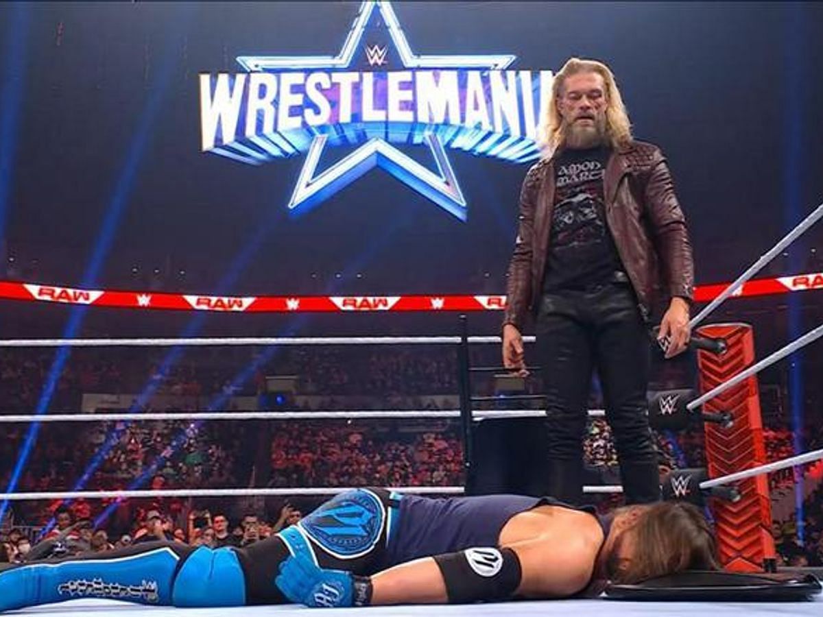 Edge laying a beatdown on AJ Styles after the latter stepped up to challenge him at WrestleMania