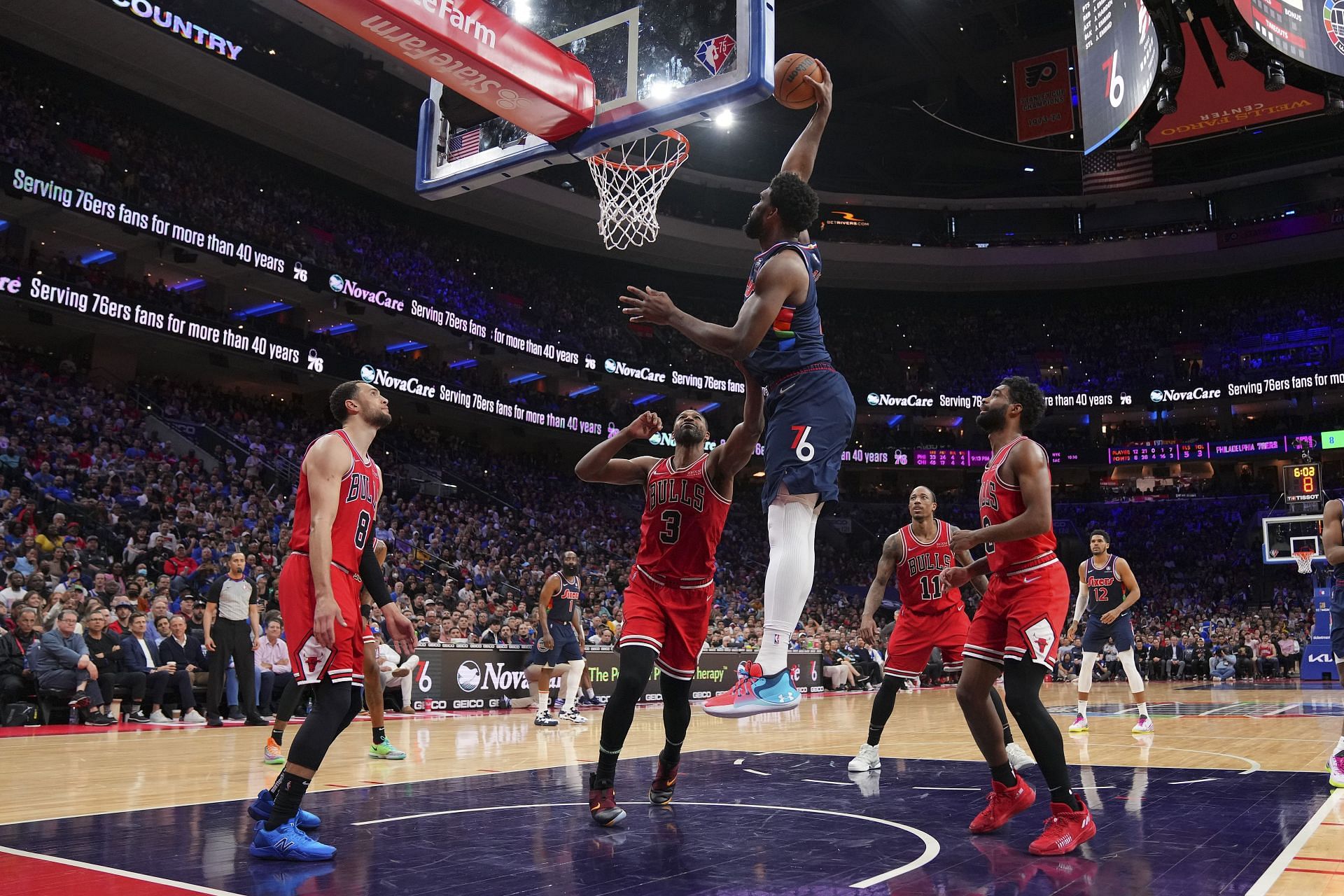 Joel Embiid of the Philadelphia 76ers dunks past Zach LaVine (8), Tristan Thompson (3), DeMar DeRozan (11) and Coby White of the Chicago Bulls