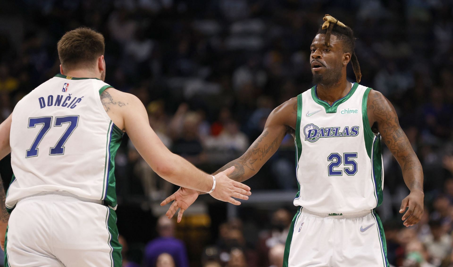 Luka Doncic and Reggie Bullock celebrate a play