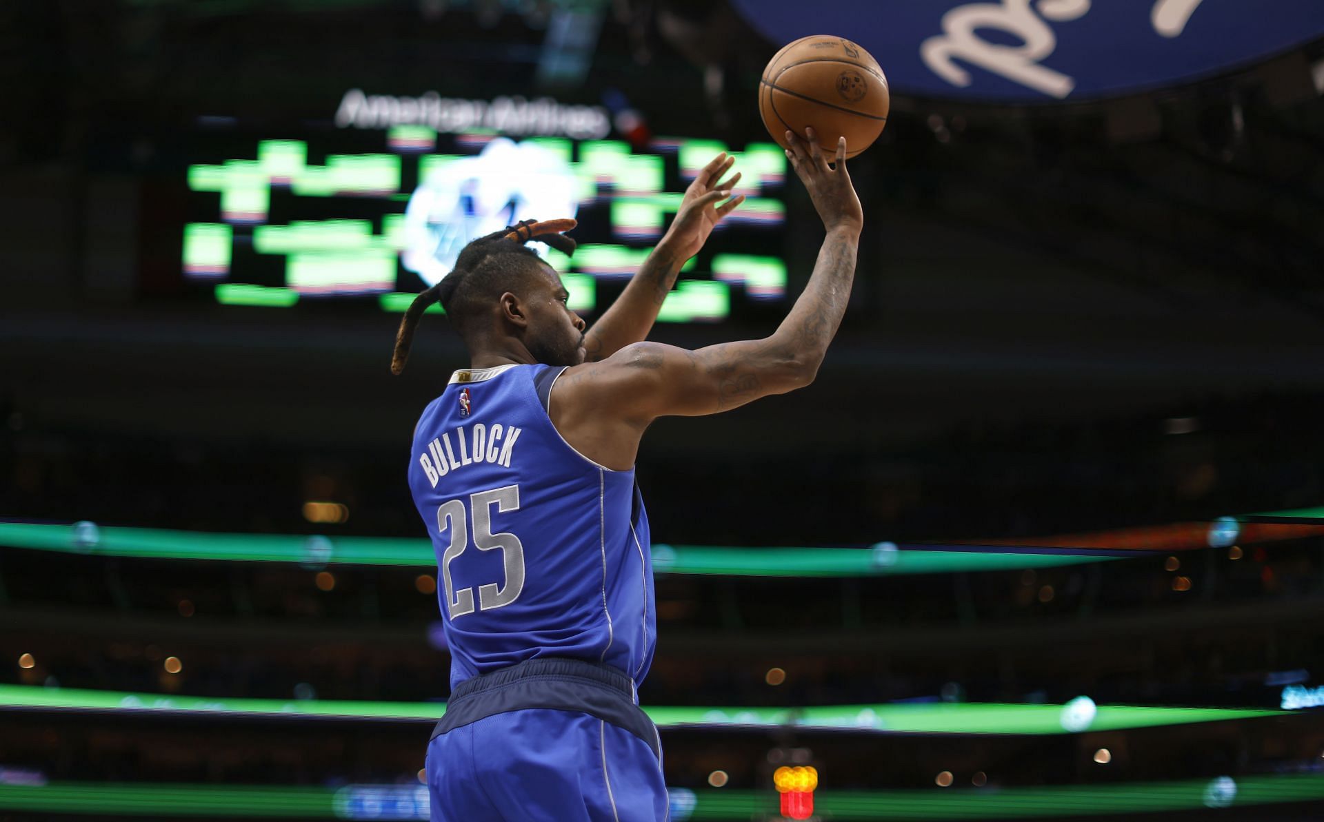 Reggie Bullock attempts a three-pointer for Dallas.