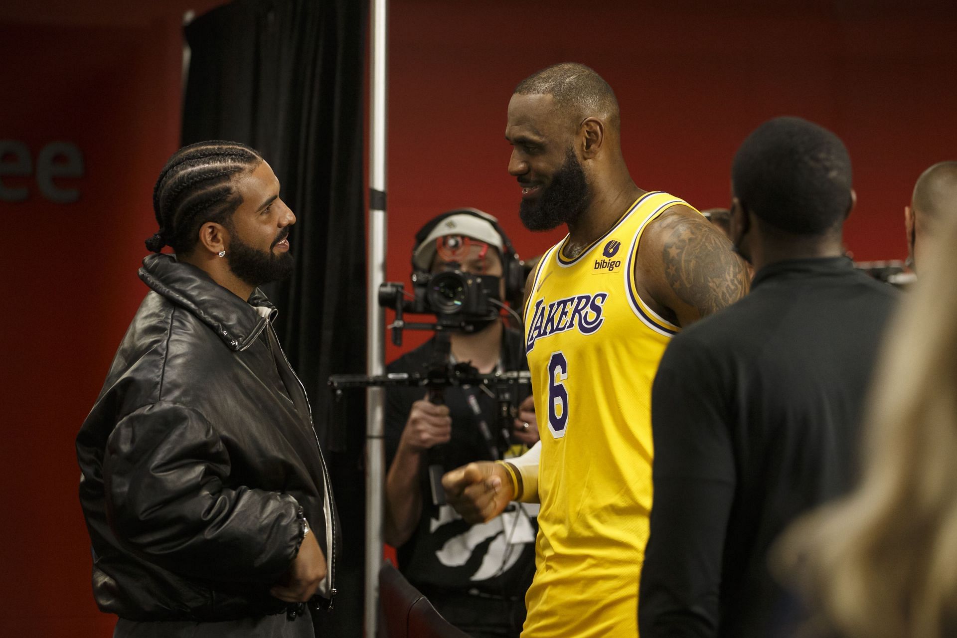 Drake talking to LeBron James of the LA Lakers.