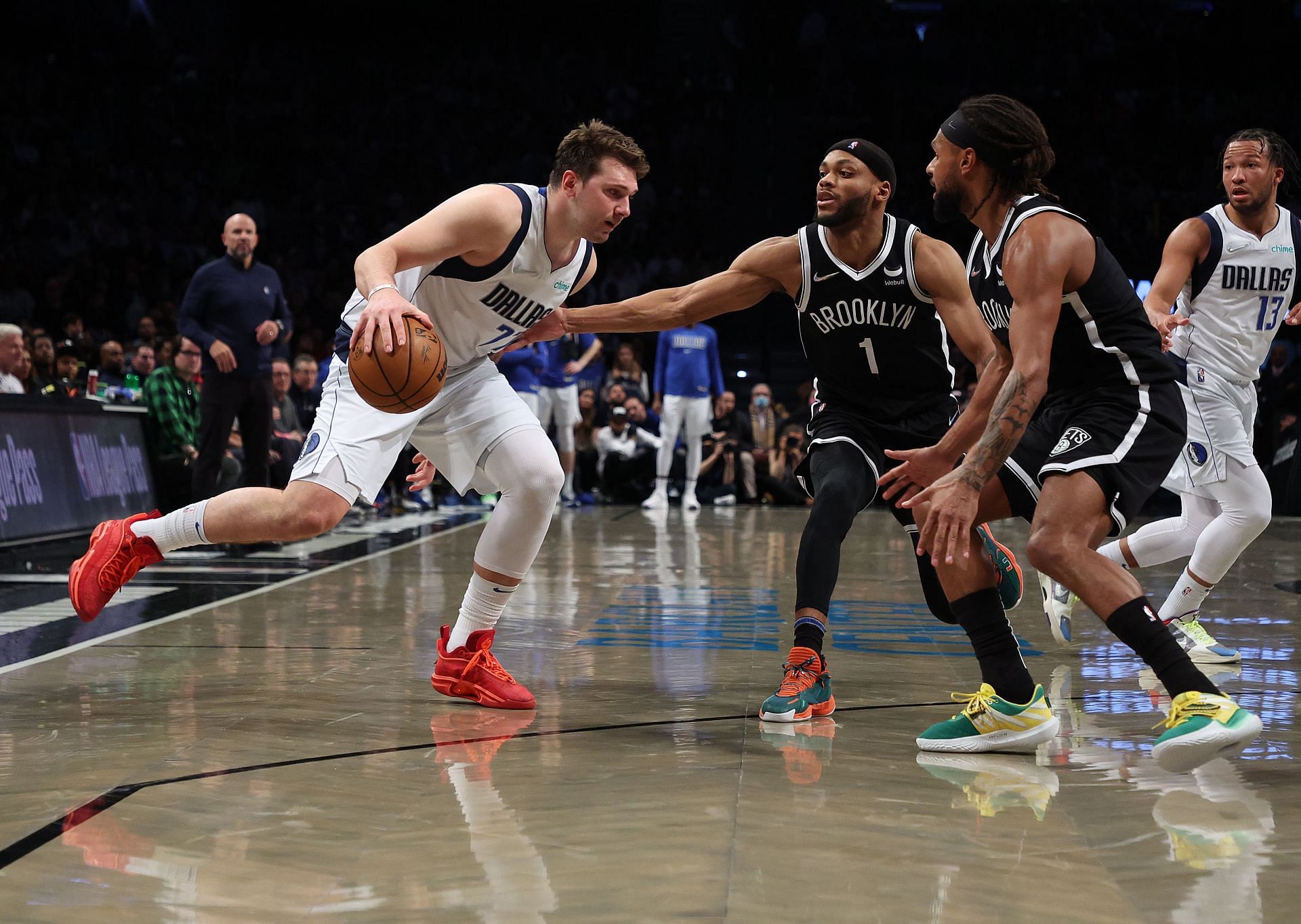 Luka Doncic of the Dallas Mavericks drives against Bruce Brown of the Brooklyn Nets.