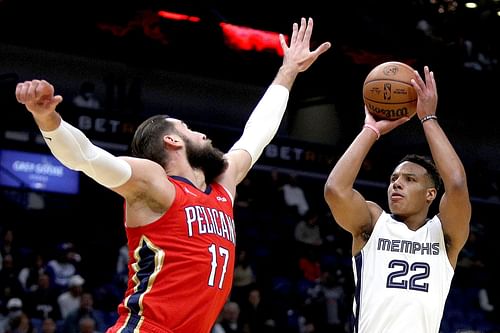 Desmond Bane shooting a jumper over Jonas Valanciunas