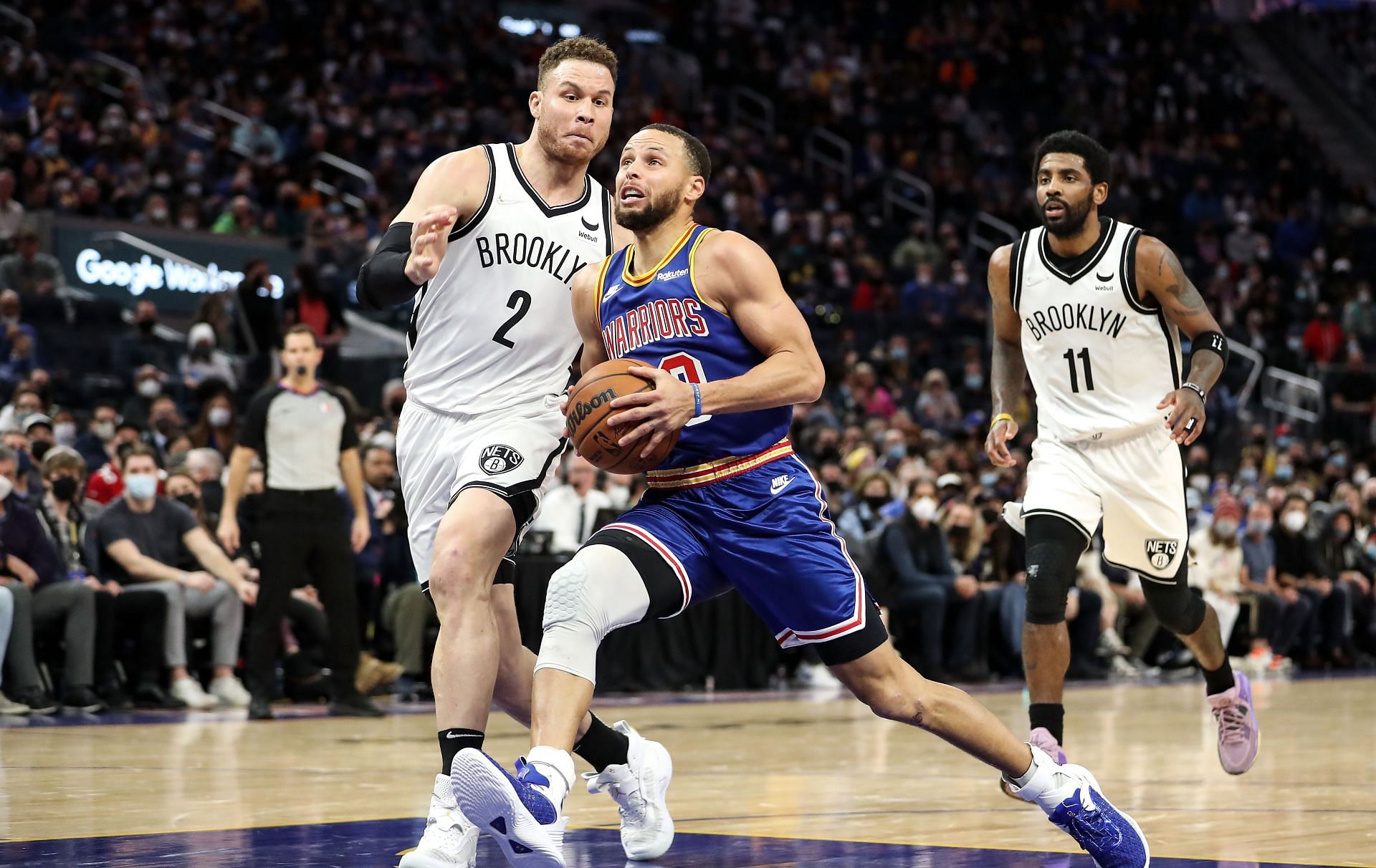 Stephen Curry #30 of the Golden State Warriors drives to the basket in the second half against Blake Griffin #2 of the Brooklyn Nets