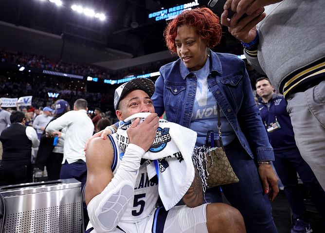 Watch: An injured, crying Justin Moore gets consoled by teammates, is later seen leaving on crutches as Villanova beats Houston to reach Final 4 in March Madness