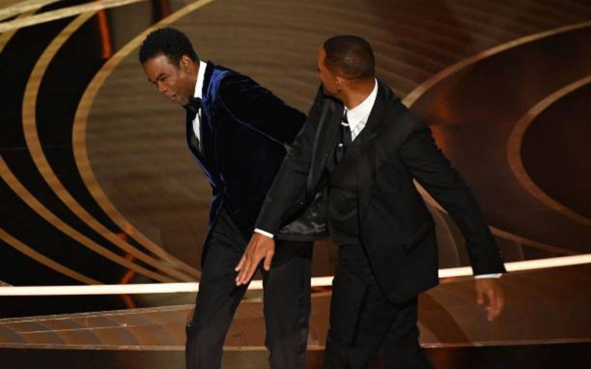 Will Smith and Chris Rock&#039;s on-stage altercation at the Oscars (Image via Getty Images)