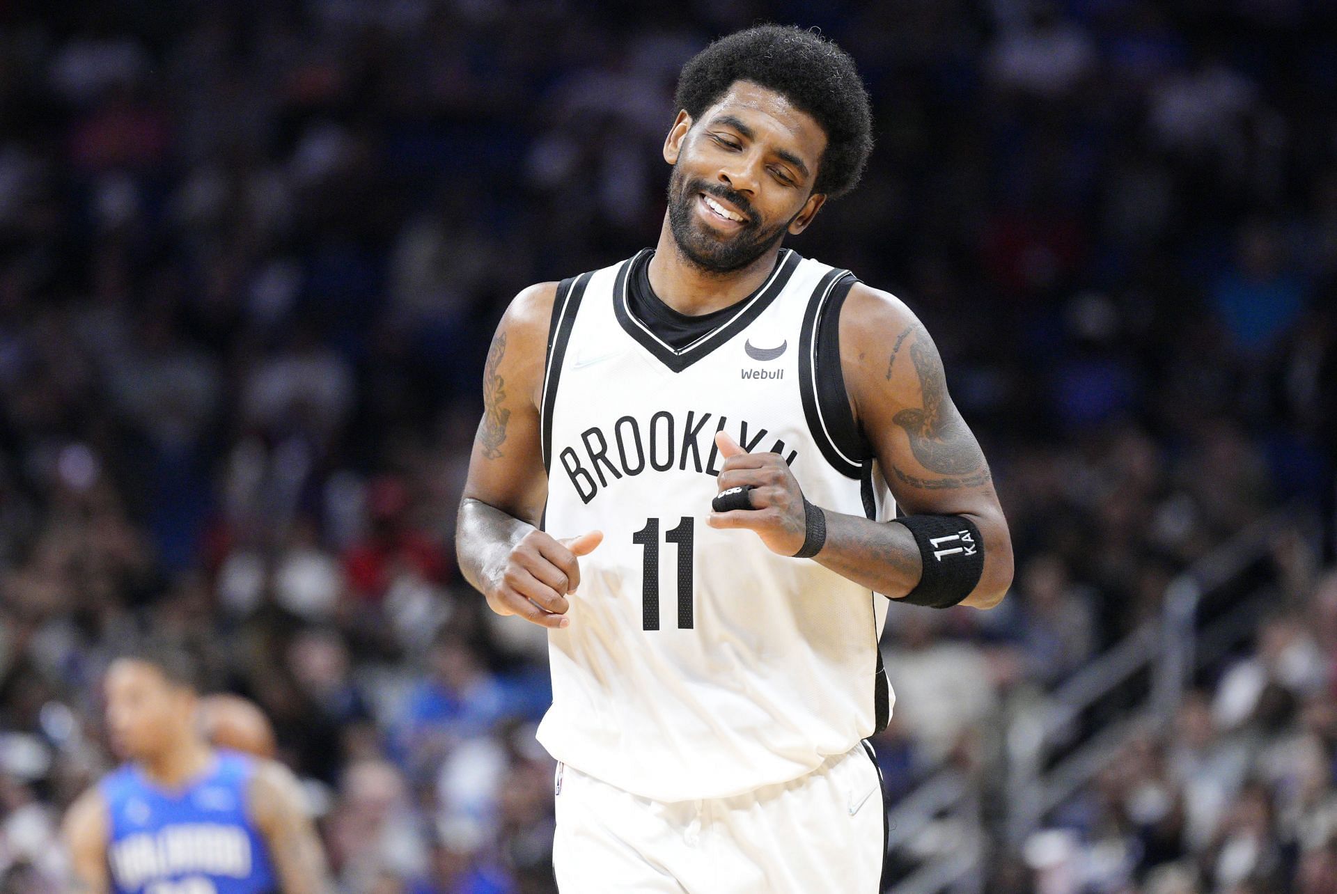 Kyrie Irving of the Brooklyn Nets reacts after scoring against the Orlando Magic