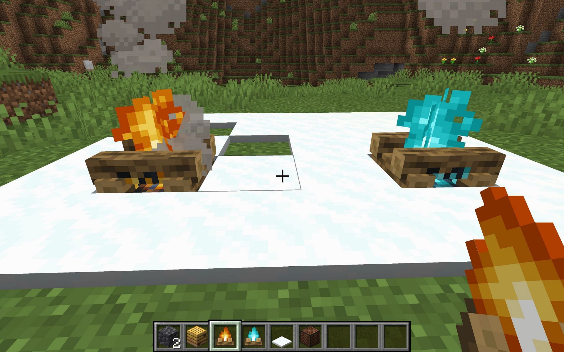 Each fire handles snow and ice differently, the regular campfire will melt them, but the soul campfire will not (Image via Mojang)
