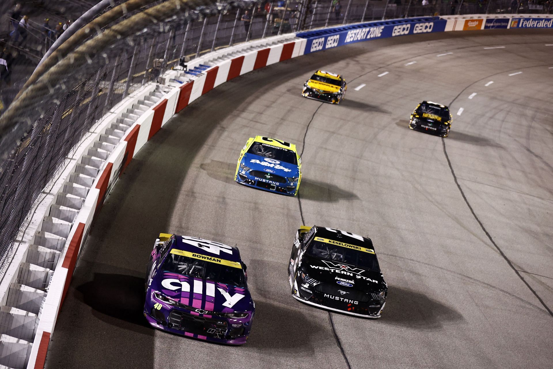 Alex Bowman and Brad Keselowski race during the NASCAR Cup Series Federated Auto Parts 400 Salute to First Responders at Richmond Raceway (Photo by Jared C. Tilton/Getty Images)