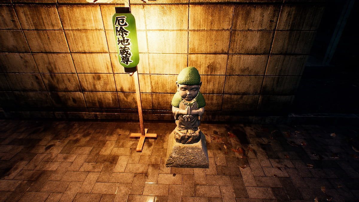 A player has approached a Jizo statue to pray in Ghostwire: Tokyo (Image via Tango Gameworks)