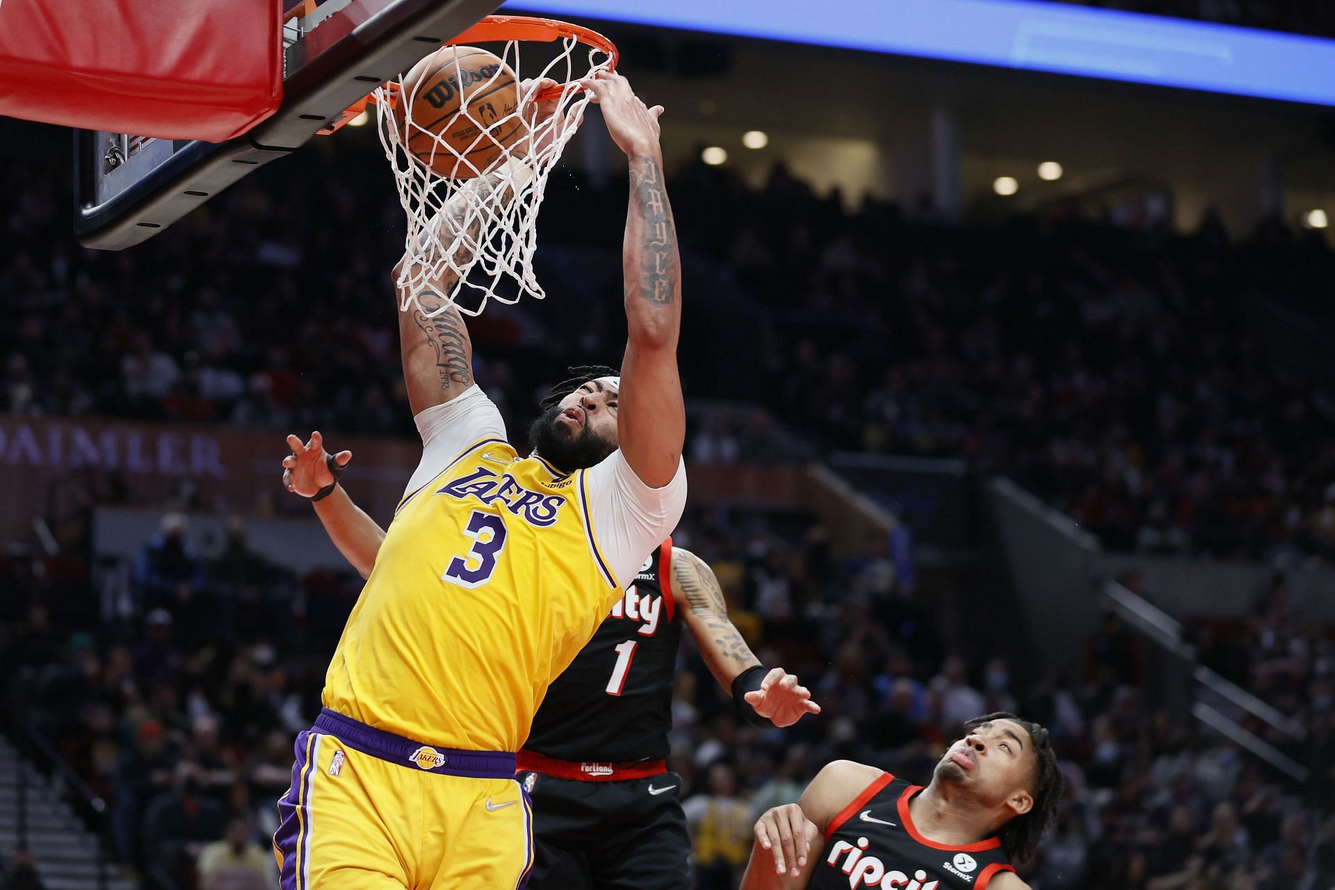 Anthony Davis #3 of the Los Angeles Lakers dunks against the Portland Trail Blazers
