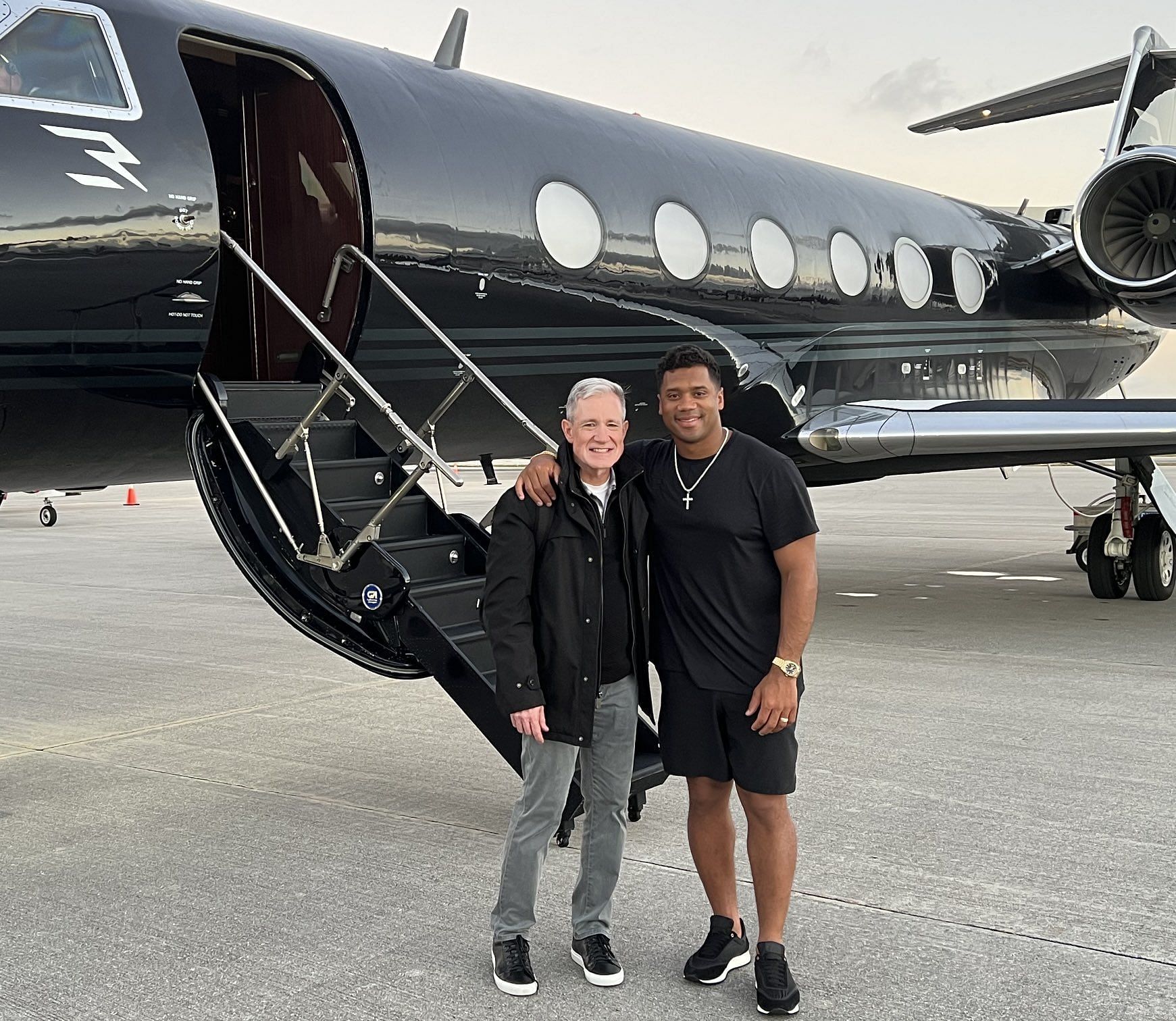Russell Wilson and his agent with his private jet