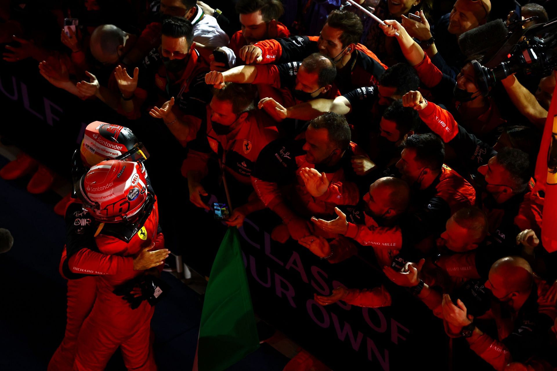 Charles Leclerc celebrates with Ferrari teammate Carlos Sainz after winning the 2022 F1 Bahrain GP (Photo by Mark Thompson/Getty Images)