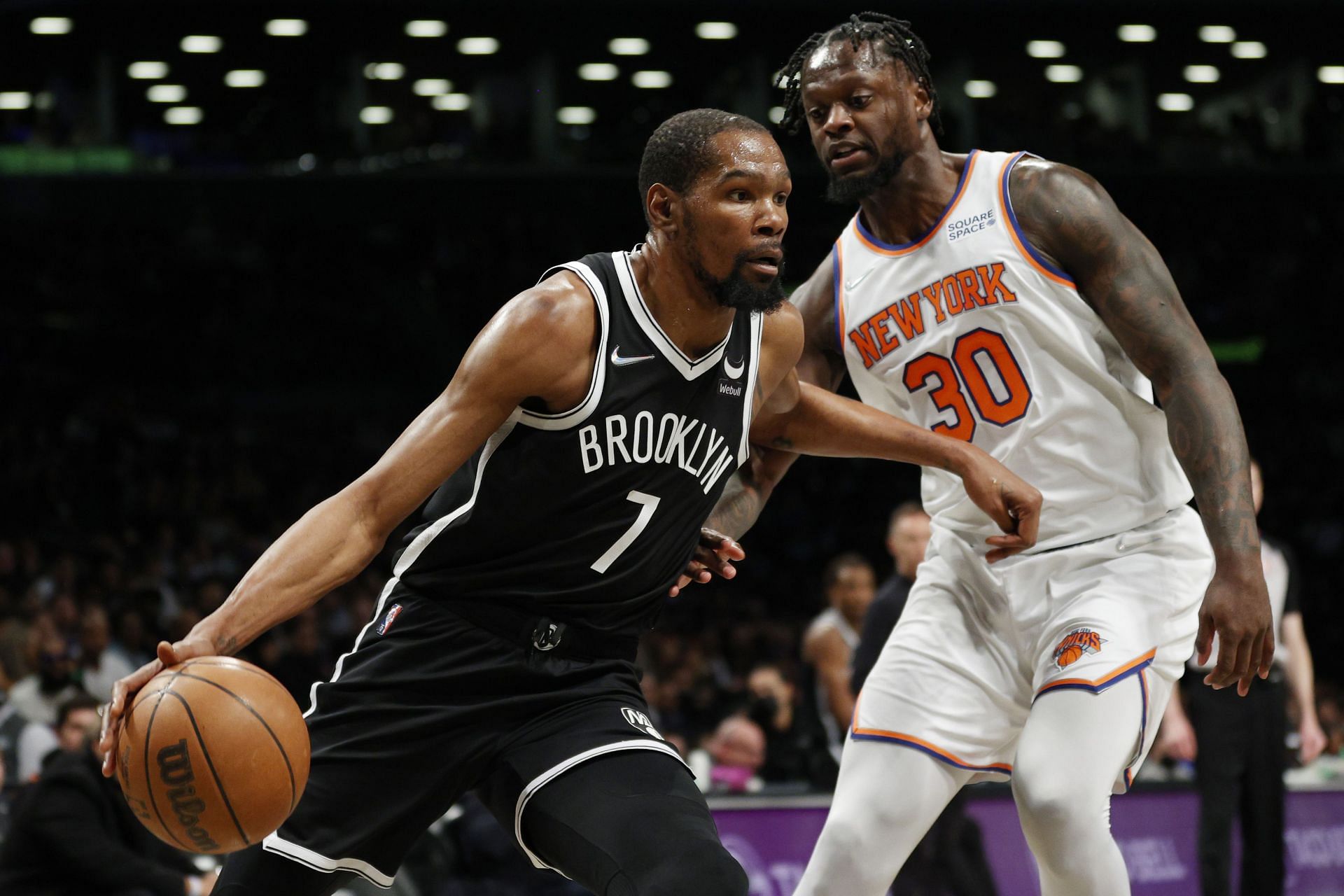 Kevin Durant of the Brooklyn Nets dribbles against Julius Randle of the New York Knicks during the first half at Barclays Center on Sunday in the Brooklyn borough of New York City.