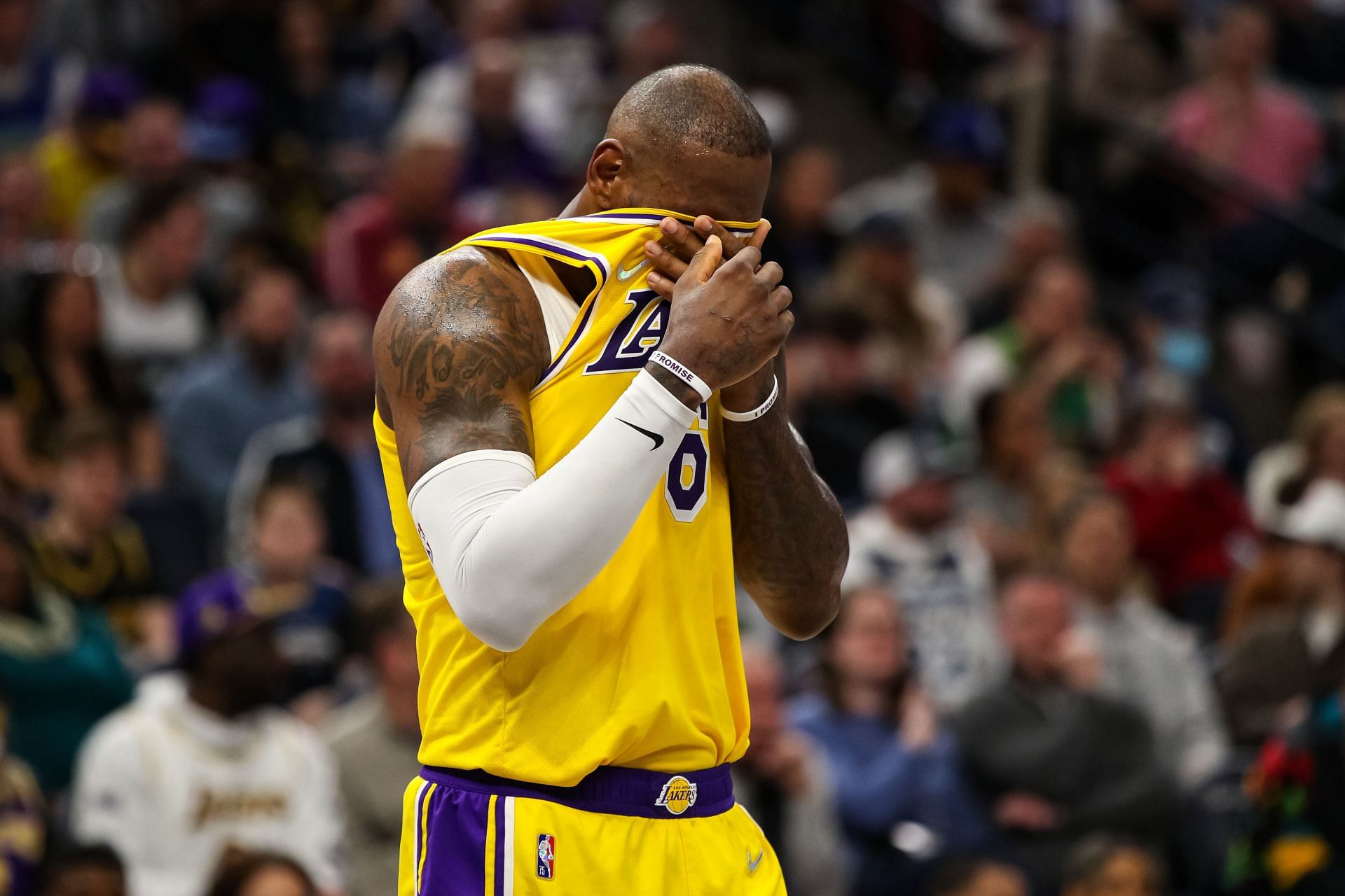 LeBron James of the LA Lakers wipes his face in the fourth quarter against the Minnesota Timberwolves on Wednesday in Minneapolis, Minnesota. The Timberwolves defeated the Lakers 124-104.