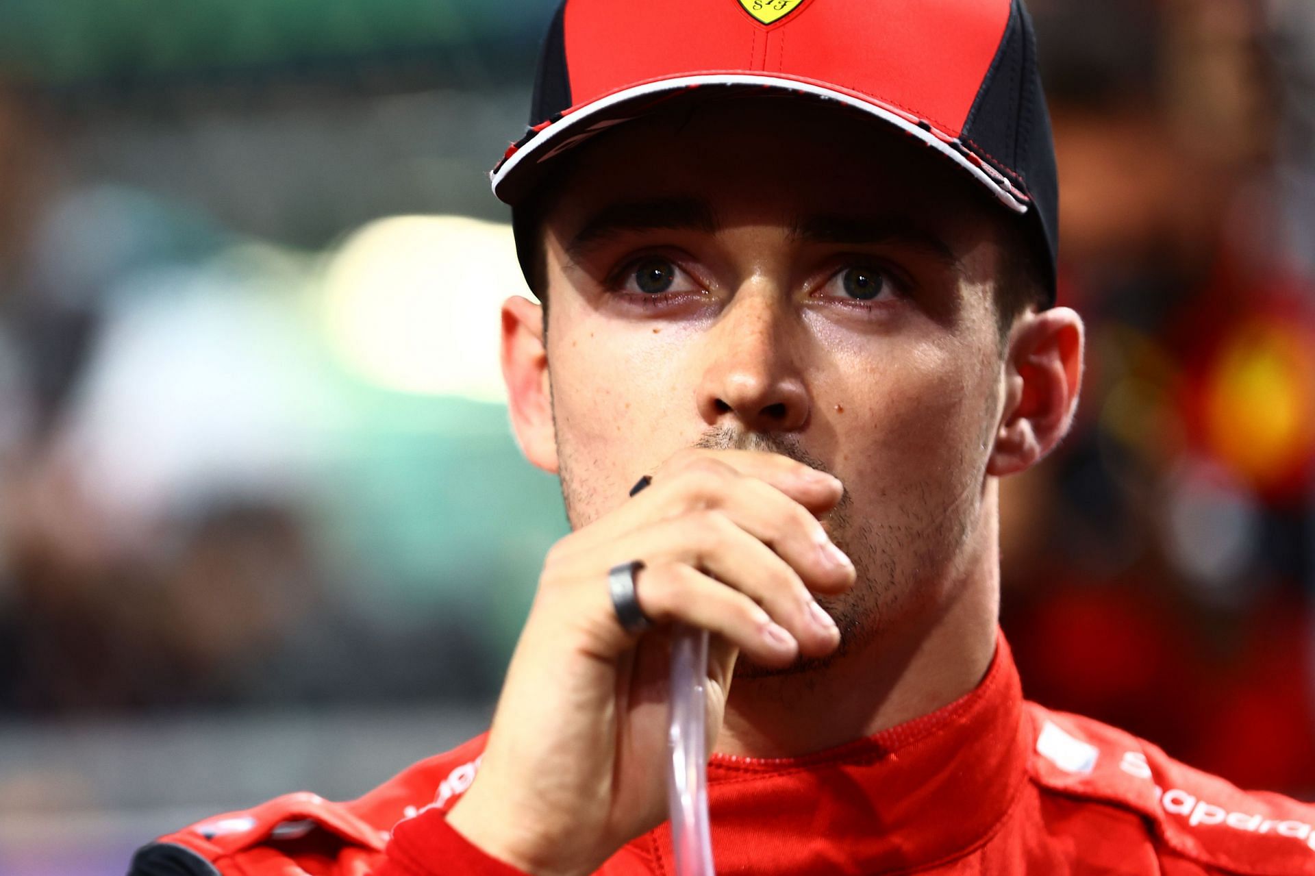 Second placed qualifier Charles Leclerc of Monaco and Ferrari takes a drink in parc ferme during qualifying ahead of the F1 Grand Prix of Saudi Arabia at the Jeddah Corniche Circuit on March 26, 2022 in Jeddah, Saudi Arabia. (Photo by Mark Thompson/Getty Images)