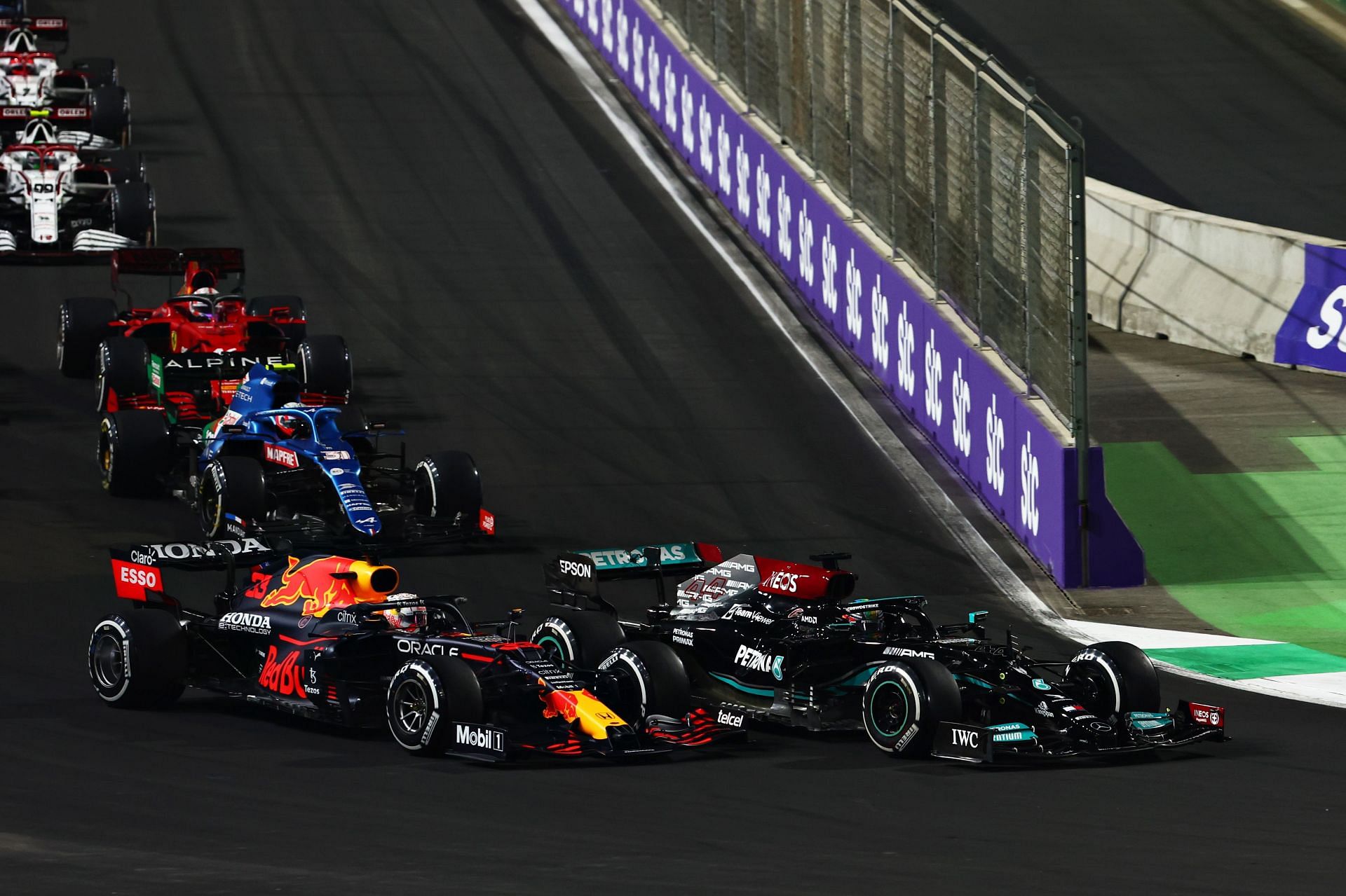 Max Verstappen (left) and Lewis Hamilton (right) battle for track position at the 2021 F1 Grand Prix of Saudi Arabia