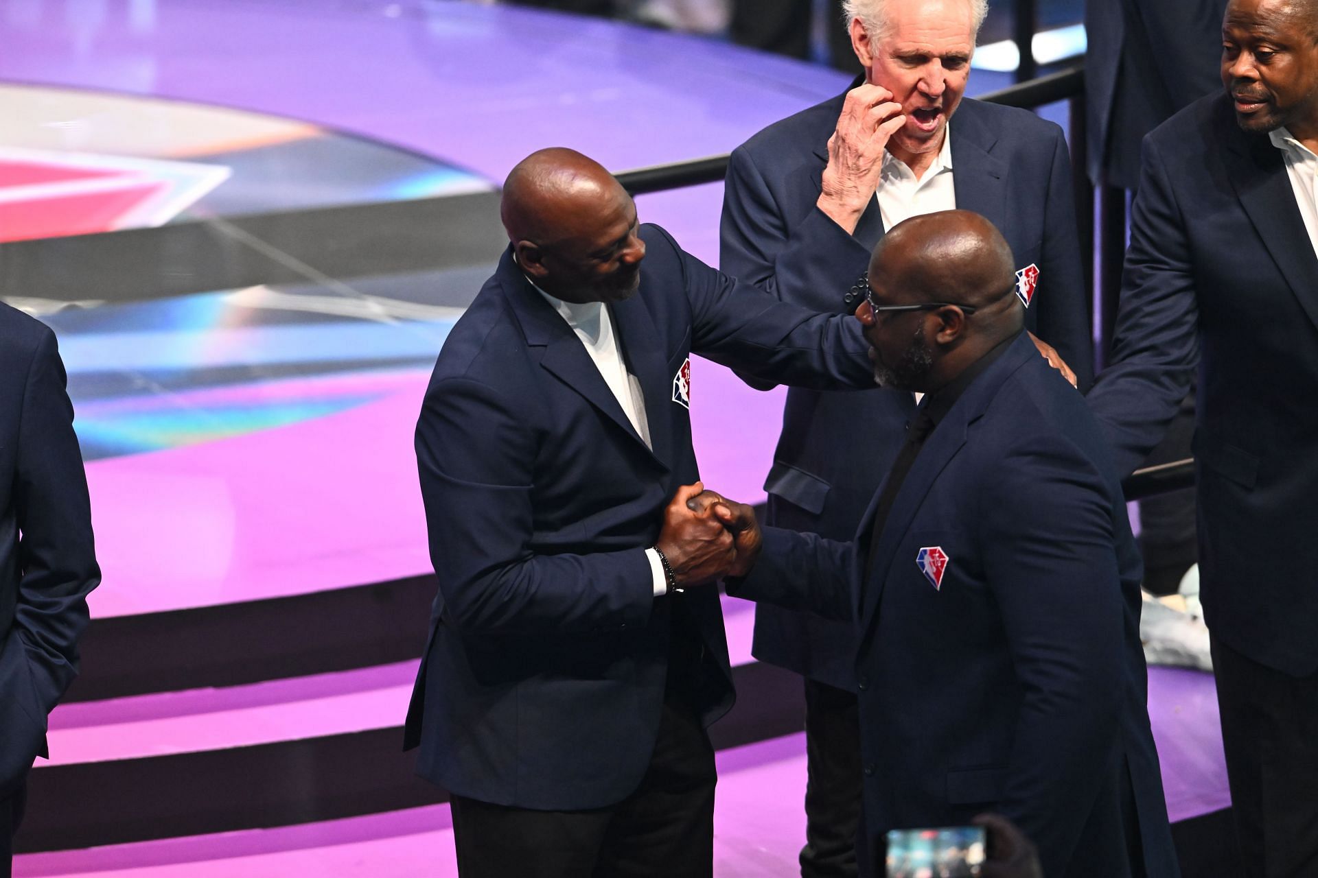Shaquille O&#039;Neal and Michael Jordan interact after introduced as part of the NBA 75th Anniversary Team during the 2022 NBA All-Star Game at Rocket Mortgage Fieldhouse on February 20, 2022 in Cleveland, Ohio.