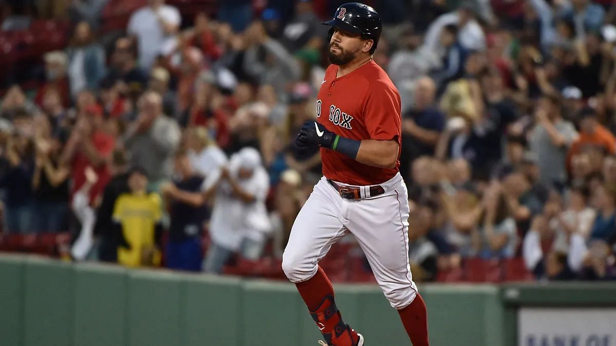 Kyle Schwarber trots the bases after a homerun at Fenway Park