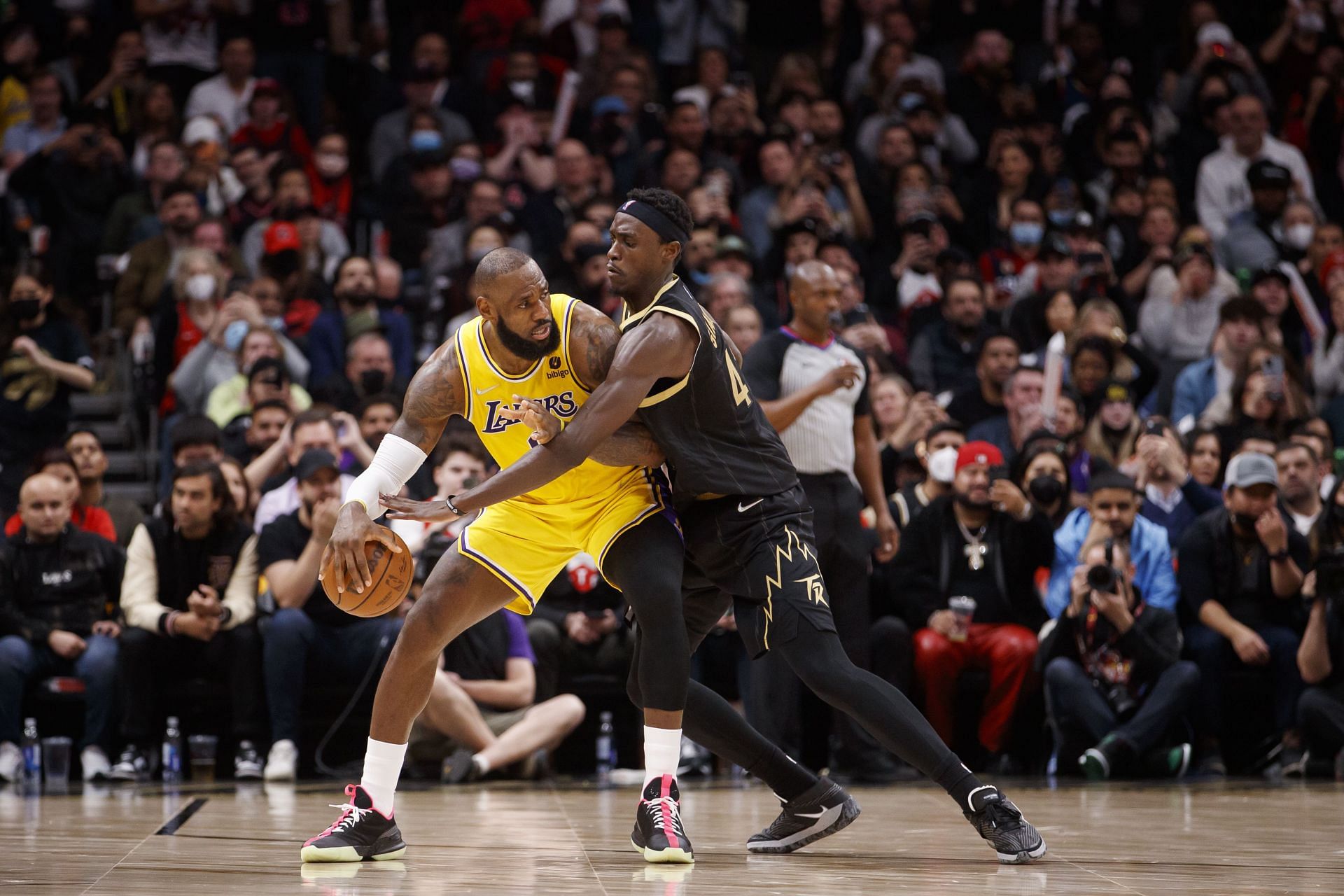 Pascal Siakam #43 of the Toronto Raptors defends against LeBron James #6 of the Los Angeles Lakers