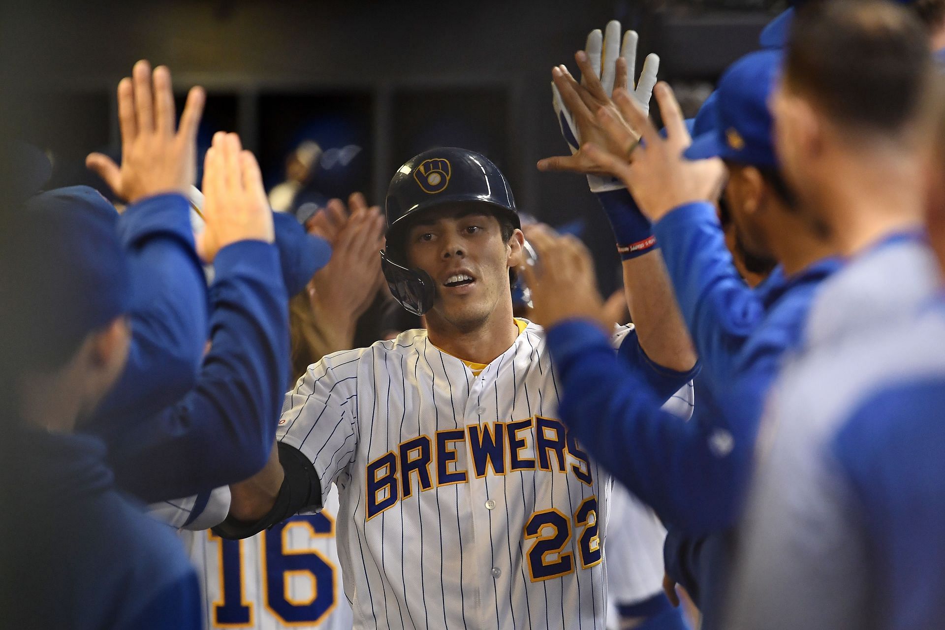 Christian Yelich receiving high fives