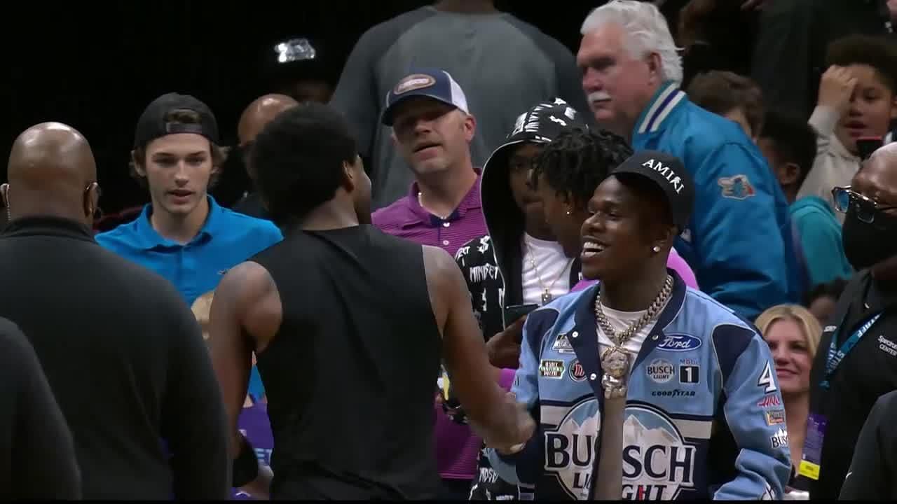 DaBaby attends the game between the Charlotte Hornets and the Los