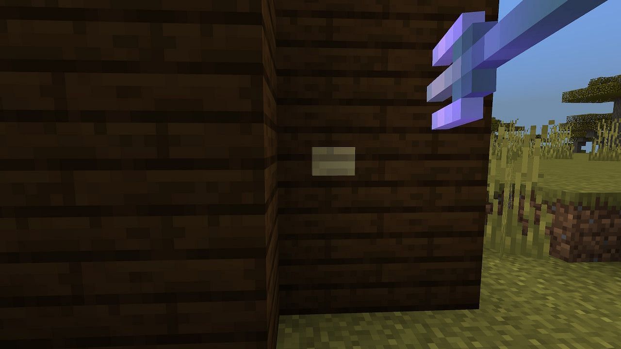 Players can throw the trident to activate wooden buttons (Image via Minecraft)