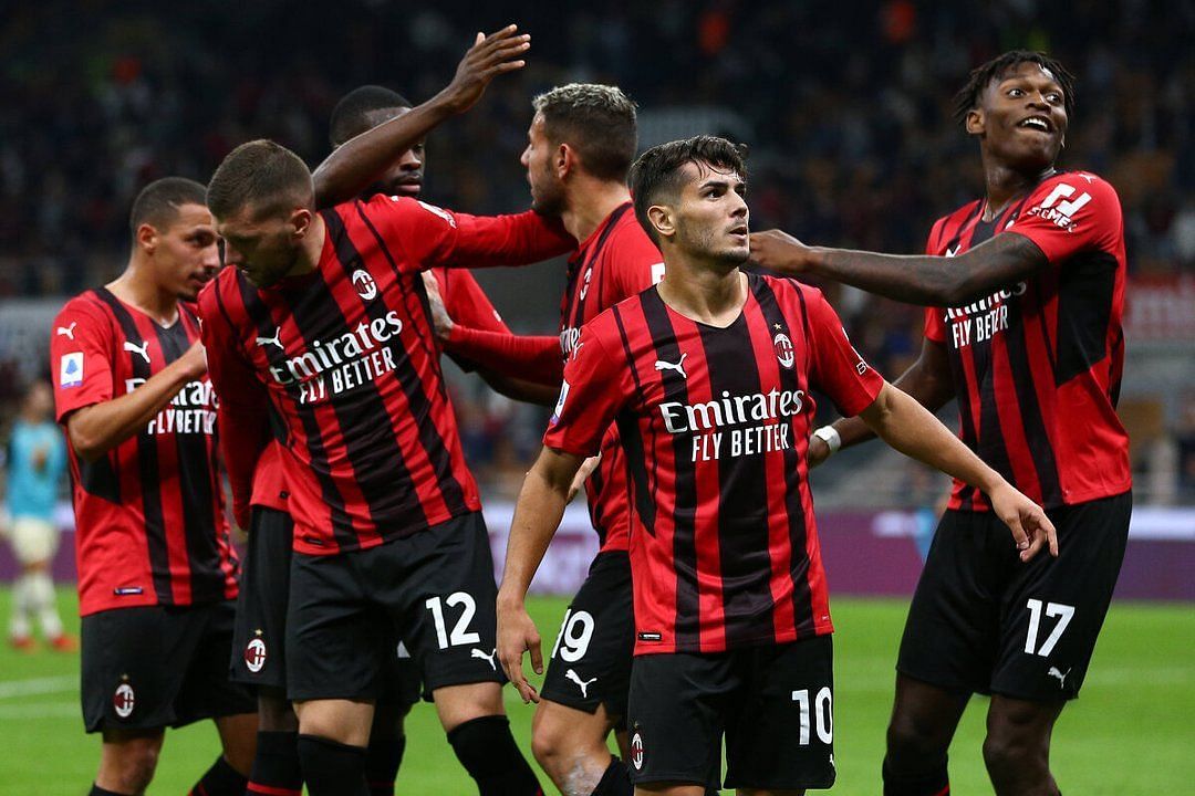 AC Milan players celebrating a goal.