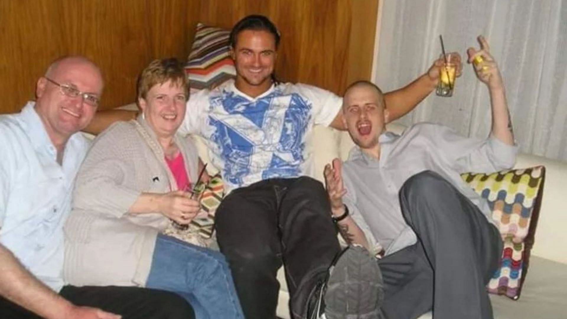 Drew McIntyre with his parents and brother