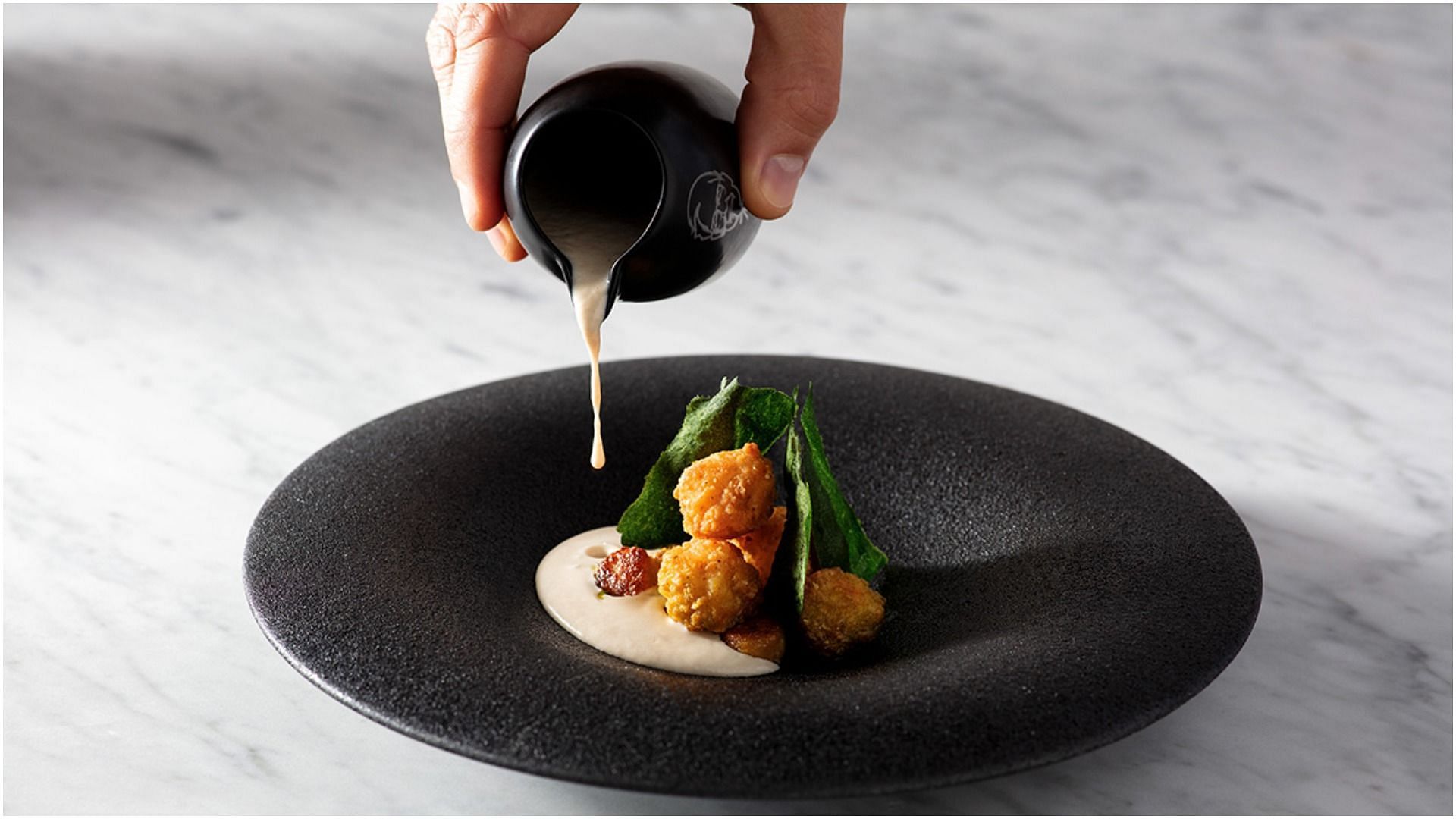 Popcorn Chicken: Paired with celeriac soup, mushroom gnocchi, and basil, topped off with an edible floral garnish (Image via KFC Australia)