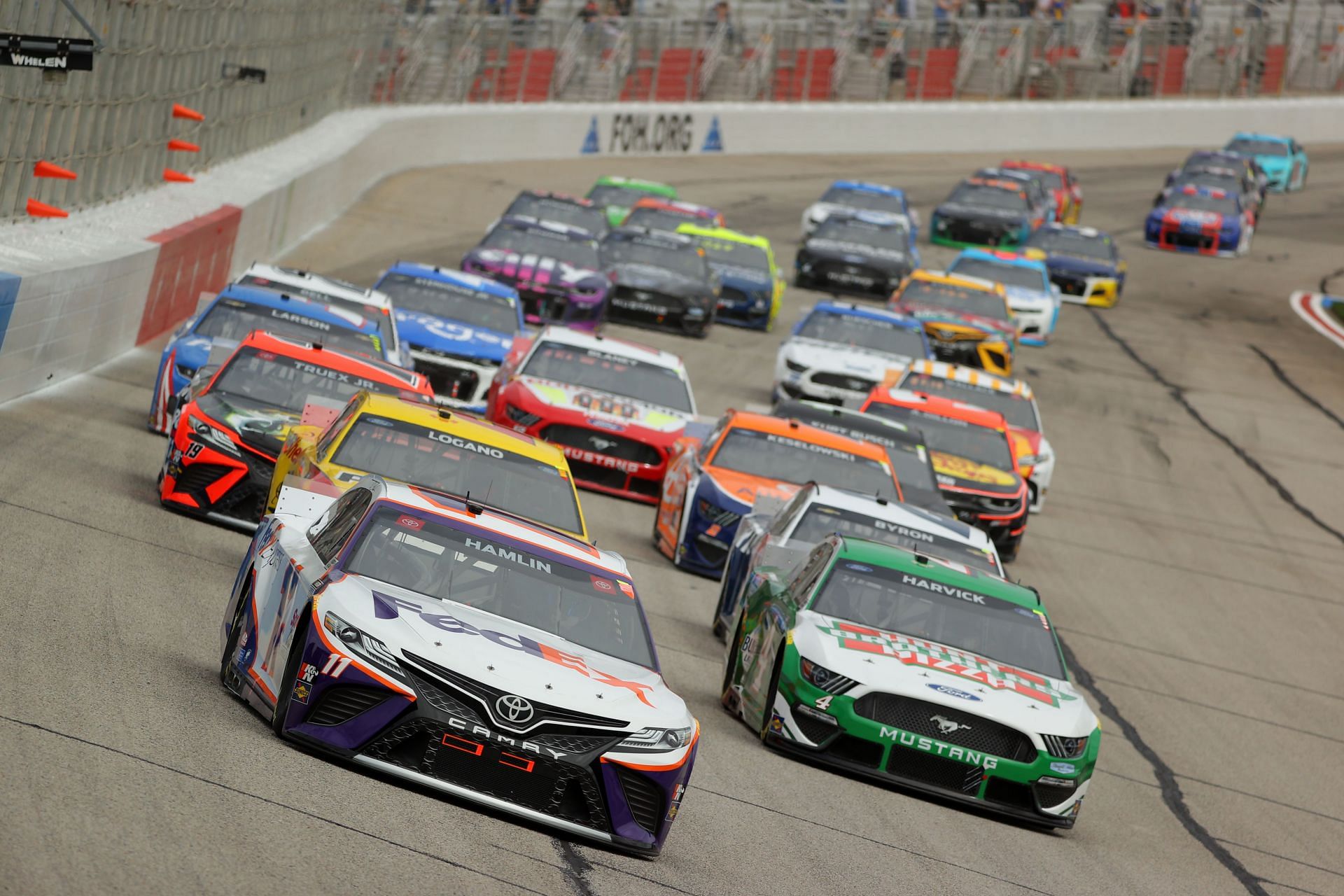 Denny Hamlin and Kevin Harvick lead the field during the 2021 NASCAR Cup Series Folds of Honor QuikTrip 500 at Atlanta Motor Speedway in Hampton, Georgia (Photo by Kevin C. Cox/Getty Images)