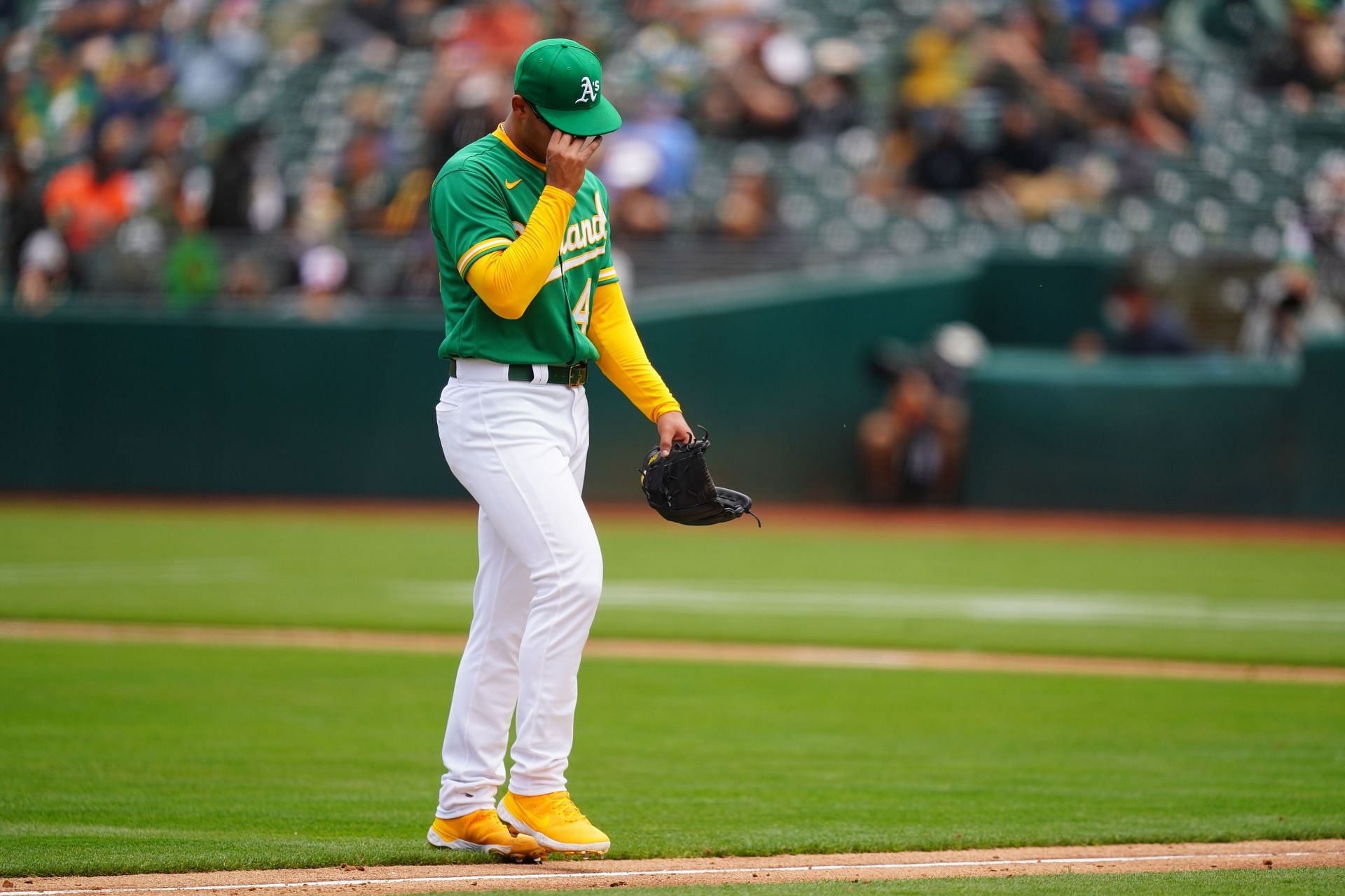 Oakland A's Jesus Luzardo walks to the dugout after giving up six runs in one inning against the Orioles