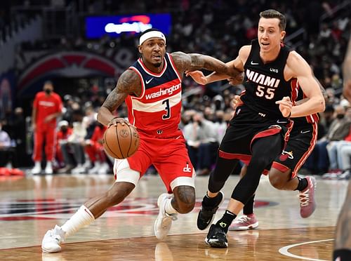 Bradley Beal taking on Miami Heat's Duncan Robinson.