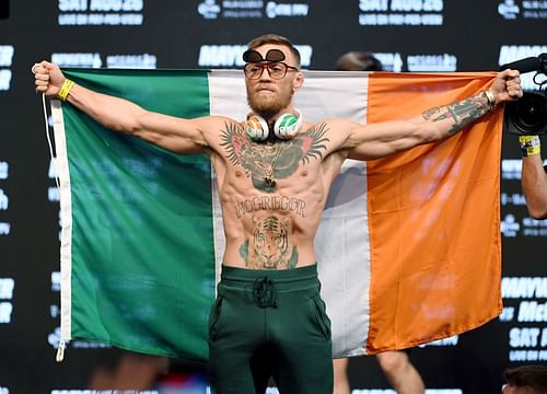 Conor McGregor raises the Irish flag