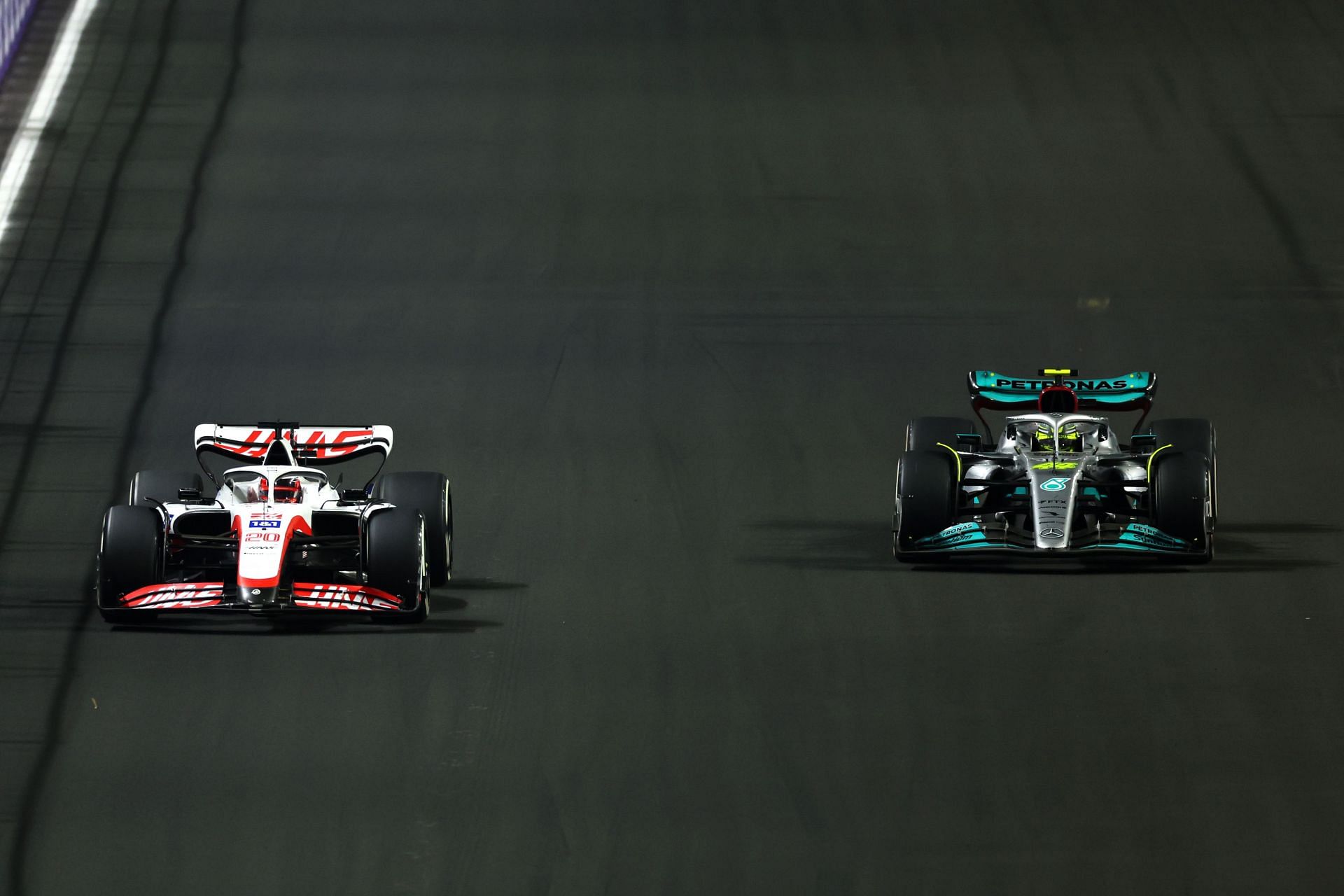Haas F1&#039;s Kevin Magnussen (left) duels with Mercedes&#039; Lewis Hamilton (right) during the 2022 F1 Saudi Arabian GP. (Photo by Lars Baron/Getty Images)