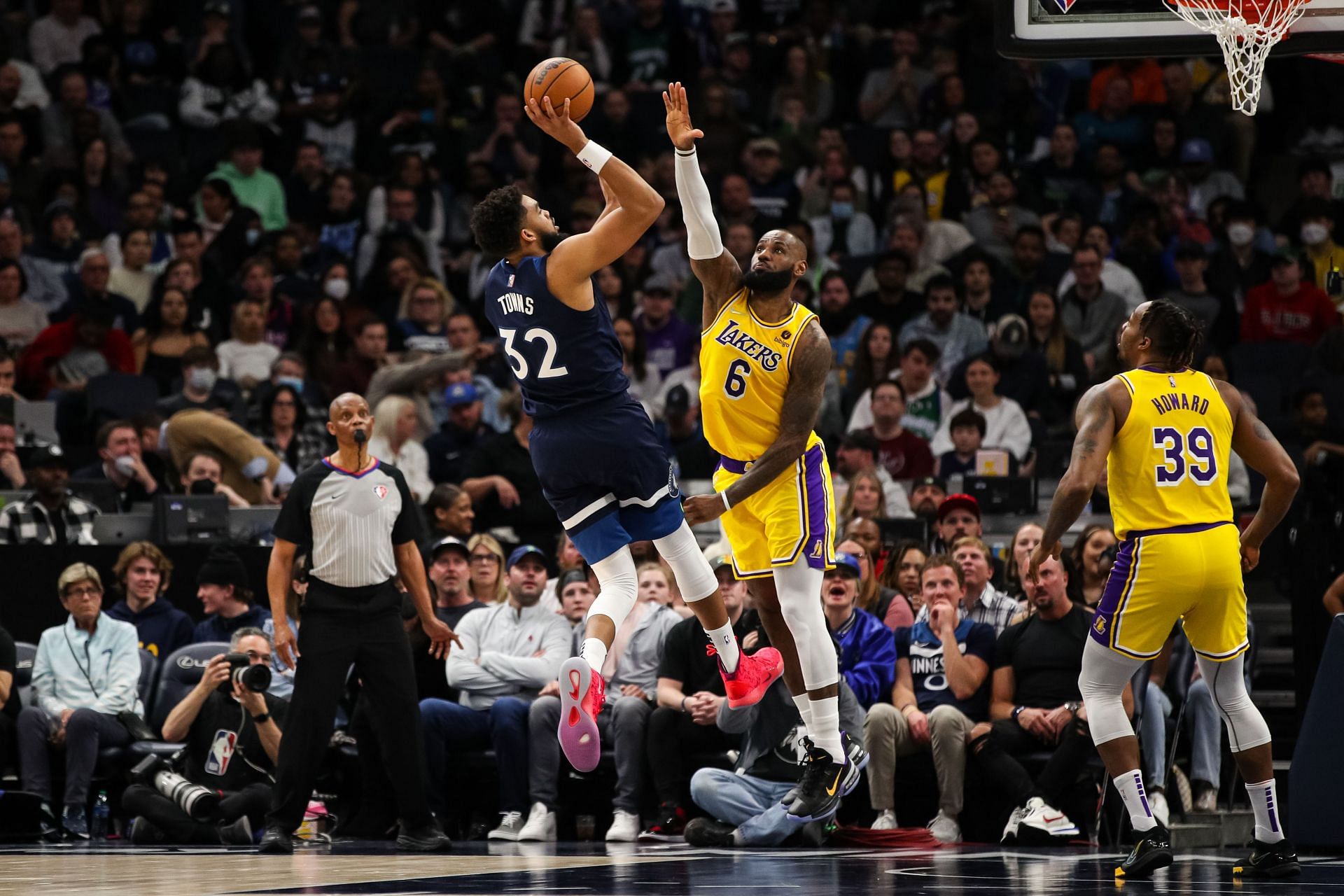 Karl-Anthony Towns of the Minnesota Timberwolves shoots the ball while LeBron James of the LA Lakers defends in the second quarter at Target Center on Wednesday in Minneapolis, Minnesota.