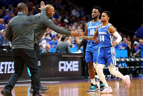 The Memphis Tigers celebrate a significant moment during an upset win over Boise State.