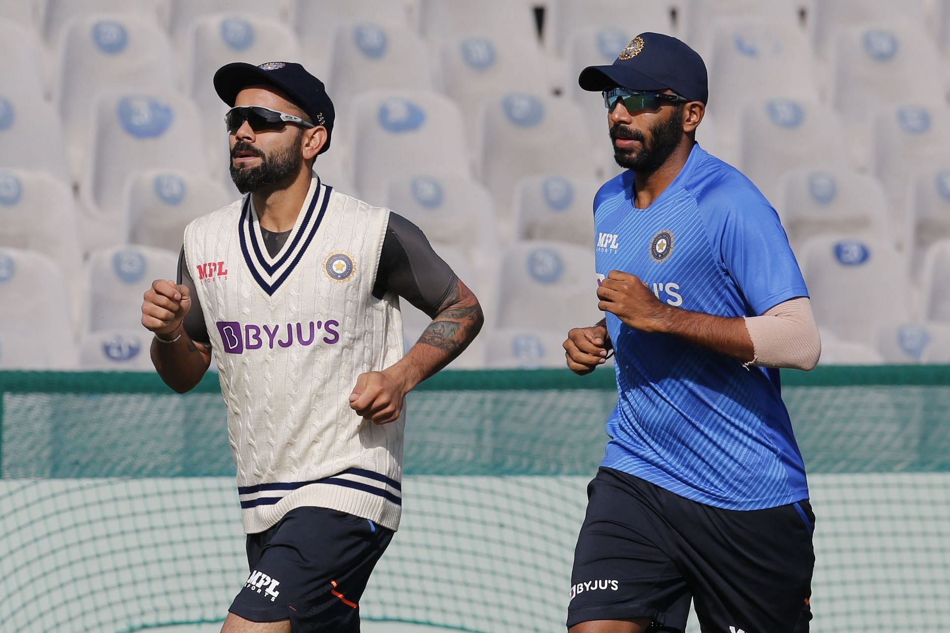 Enter caption Enter caption Enter caption Virat Kohli (L) and Jasprit Bumrah (R) during a training session in Mohali [Credits: BCCI]