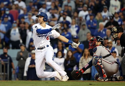 Trea Turner hits a ball into left field during last years Championship Series - Atlanta Braves v Los Angeles Dodgers - Game Three