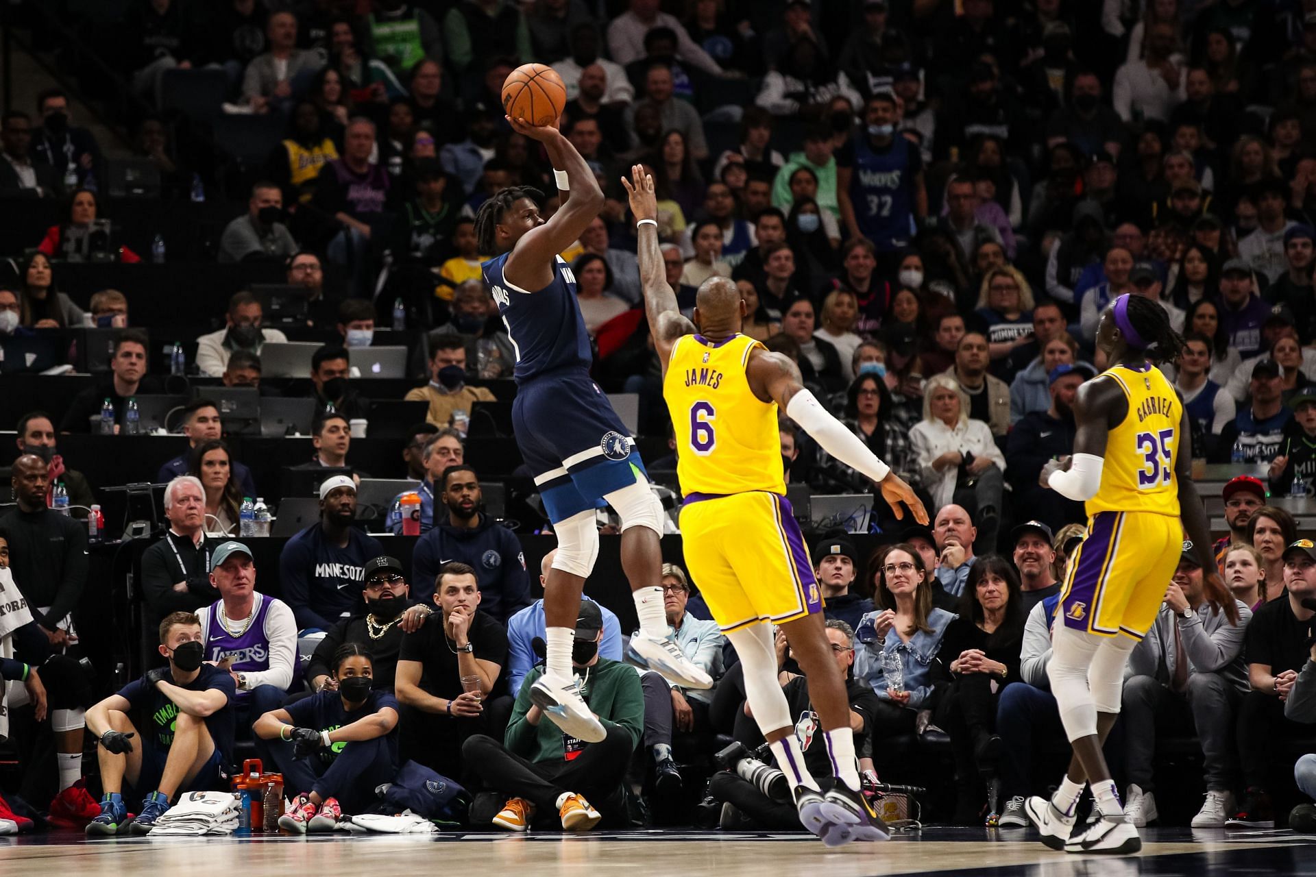 Anthony Edwards of the Minnesota Timberwolves shoots over LeBron James of the LA Lakers.