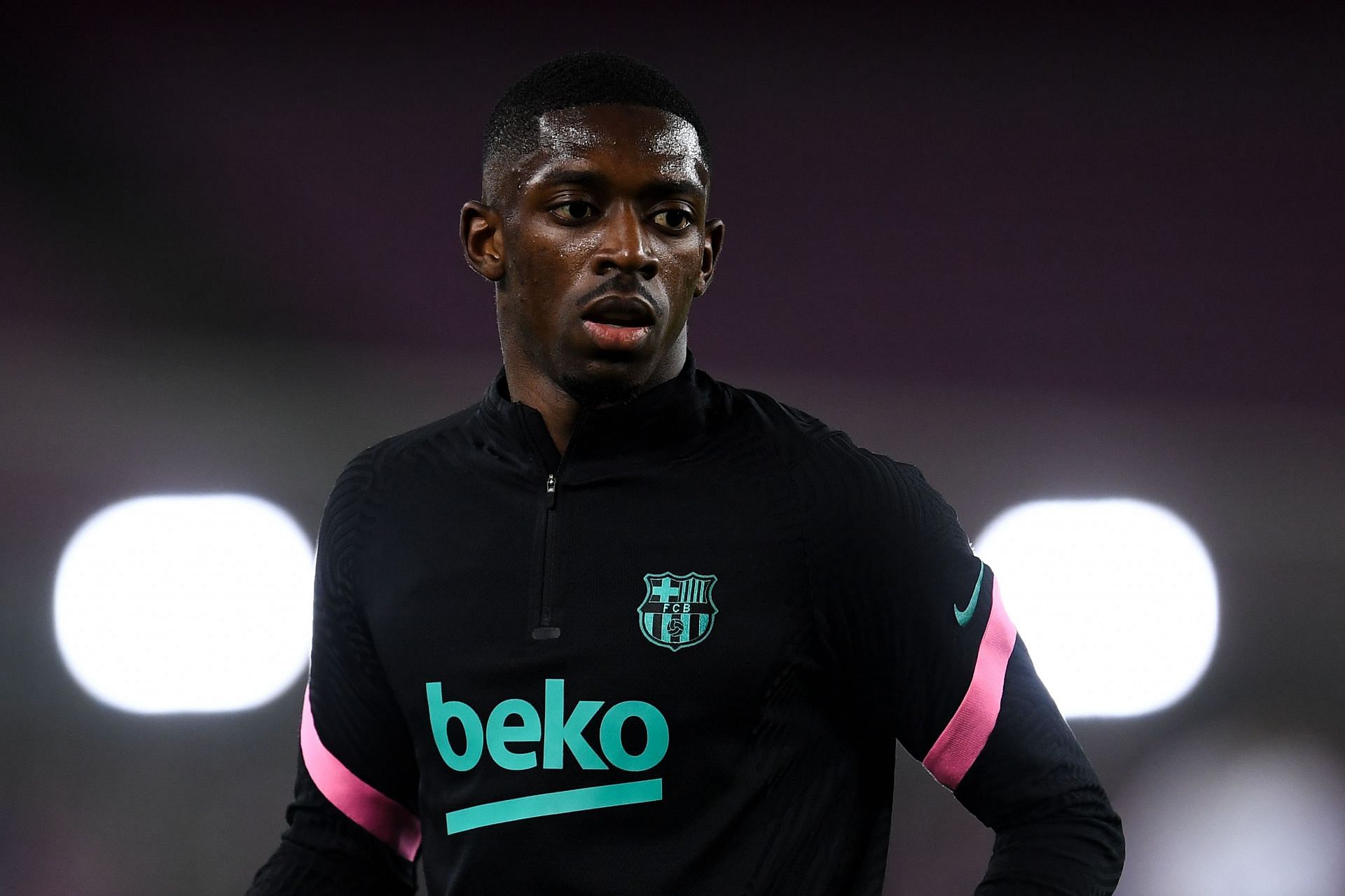 Ousmane Dembele warms up for Barcelona.