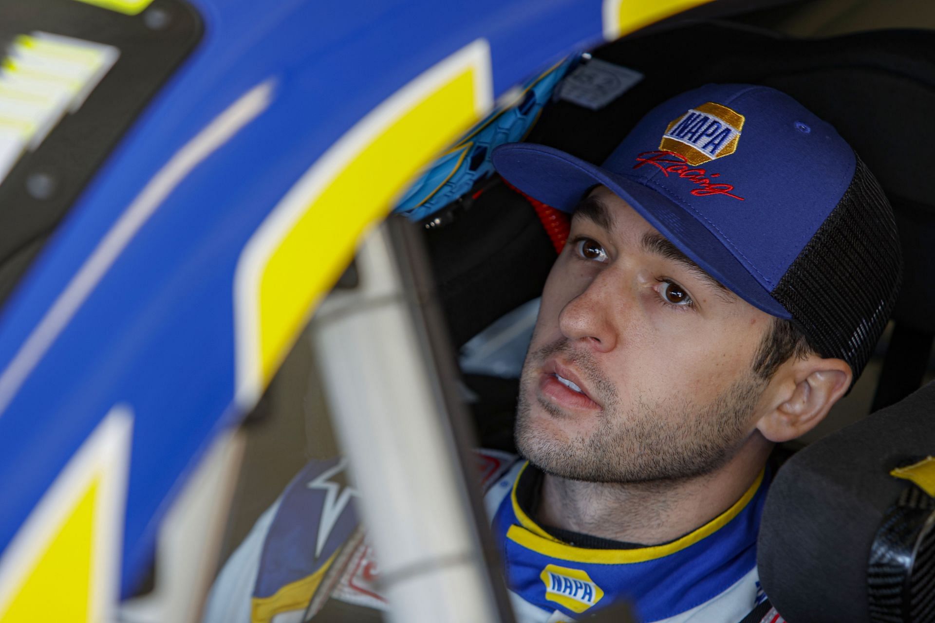 Chase Elliott sits in his car in the garage area during practice for the NASCAR Cup Series Folds of Honor QuikTrip 500 at Atlanta Motor Speedway