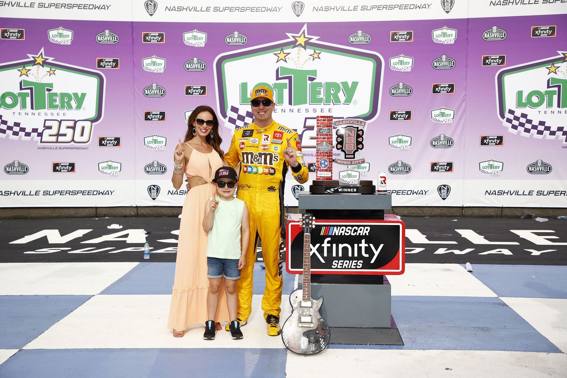 Kyle Busch, wife Samantha and son Brexton celebrate in victory lane after winning the NASCAR Xfinity Series.