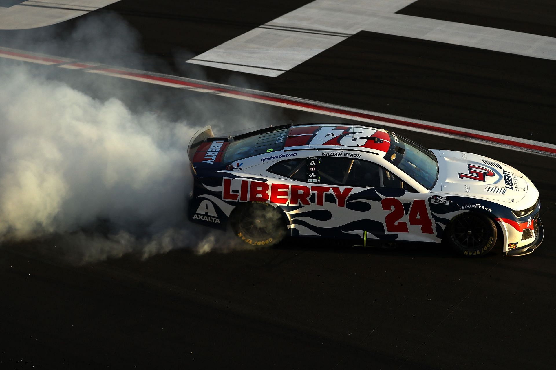 William Byron celebrates with a burnout after winning the NASCAR Cup Series Folds of Honor QuikTrip 500 at Atlanta Motor Speedway (Photo by Mike Mulholland/Getty Images)