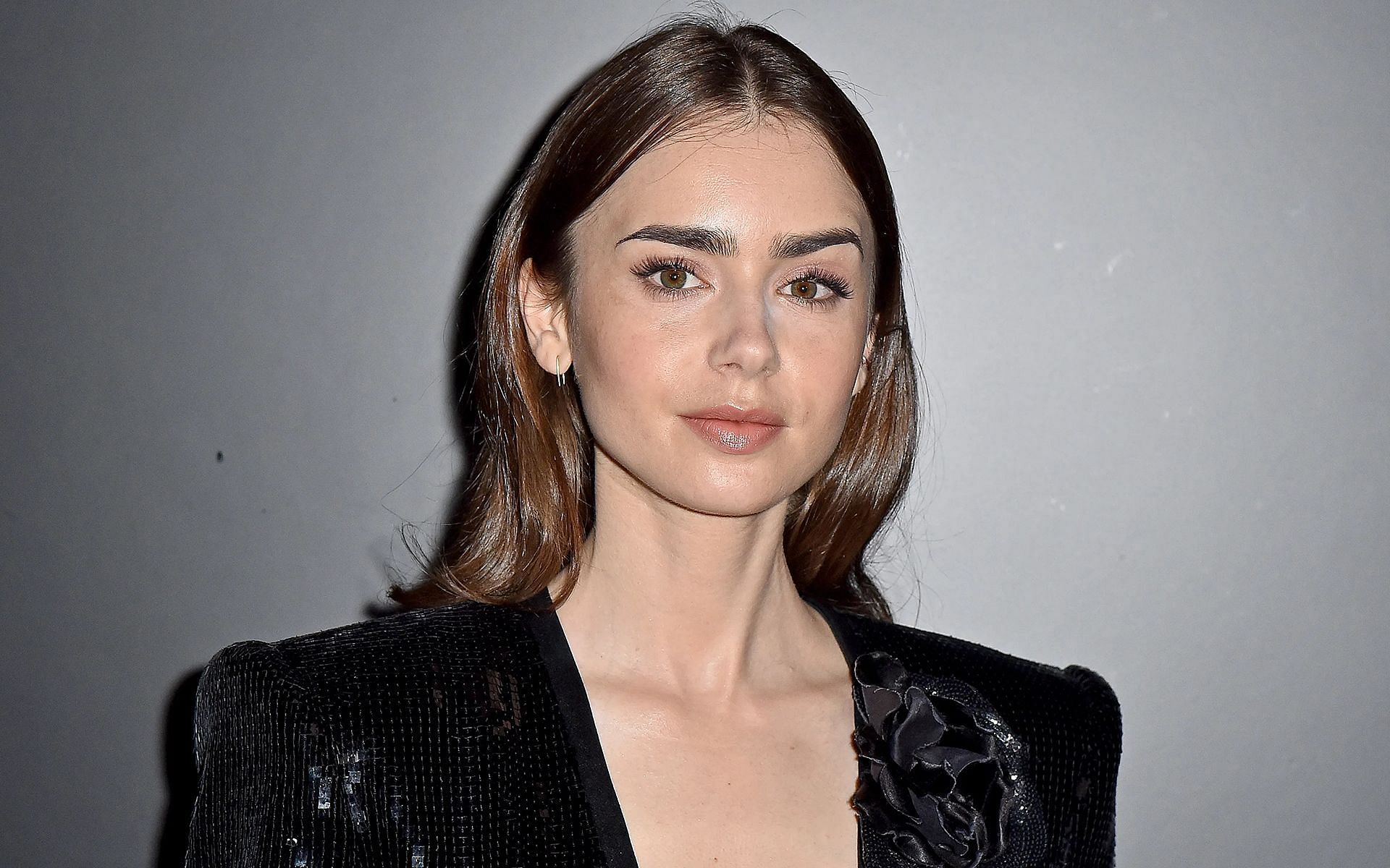 Lilly Collins discussed with Jimmy Fallon how she had to go to a Podiatrist after Emily in Paris (Image via Getty Images)